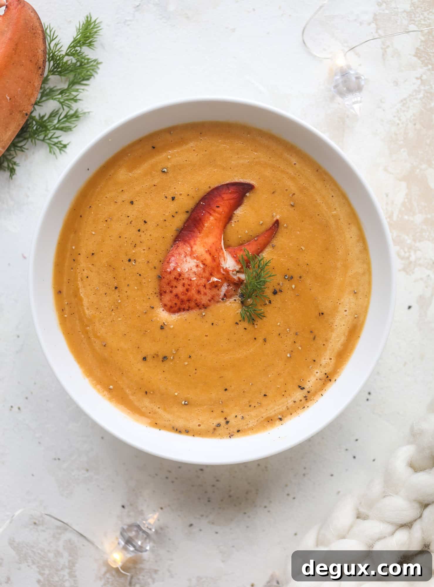 This lobster bisque recipe is delicious, easy and always a crowd pleaser! It's so simple to make at home and it's a rich, decadent treat to serve your family. I also show you how to make a lobster cappuccino, which is lobster bisque with foamed cream! I howsweeteats.com #lobster #bisque