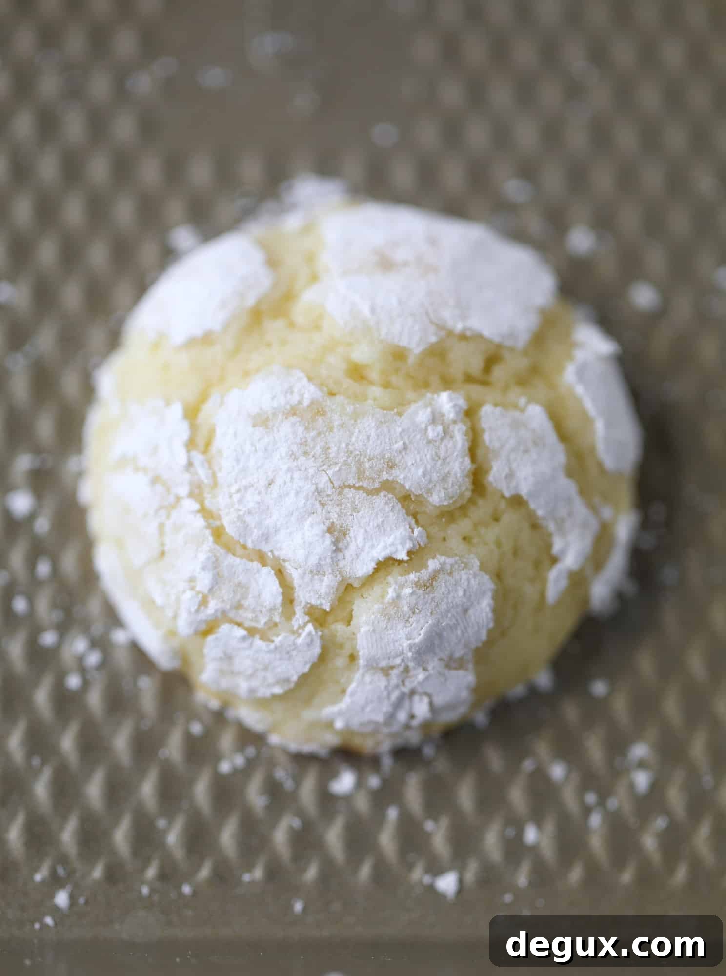 These lemon crinkle cookies are perfect if you love lemon desserts! They take after chocolate crinkle cookies, but are a delightful refreshing lemon flavor sprinkle with powdered sugar. These are always a huge hit! I howsweeteats.com #lemoncrinkle #cookies
