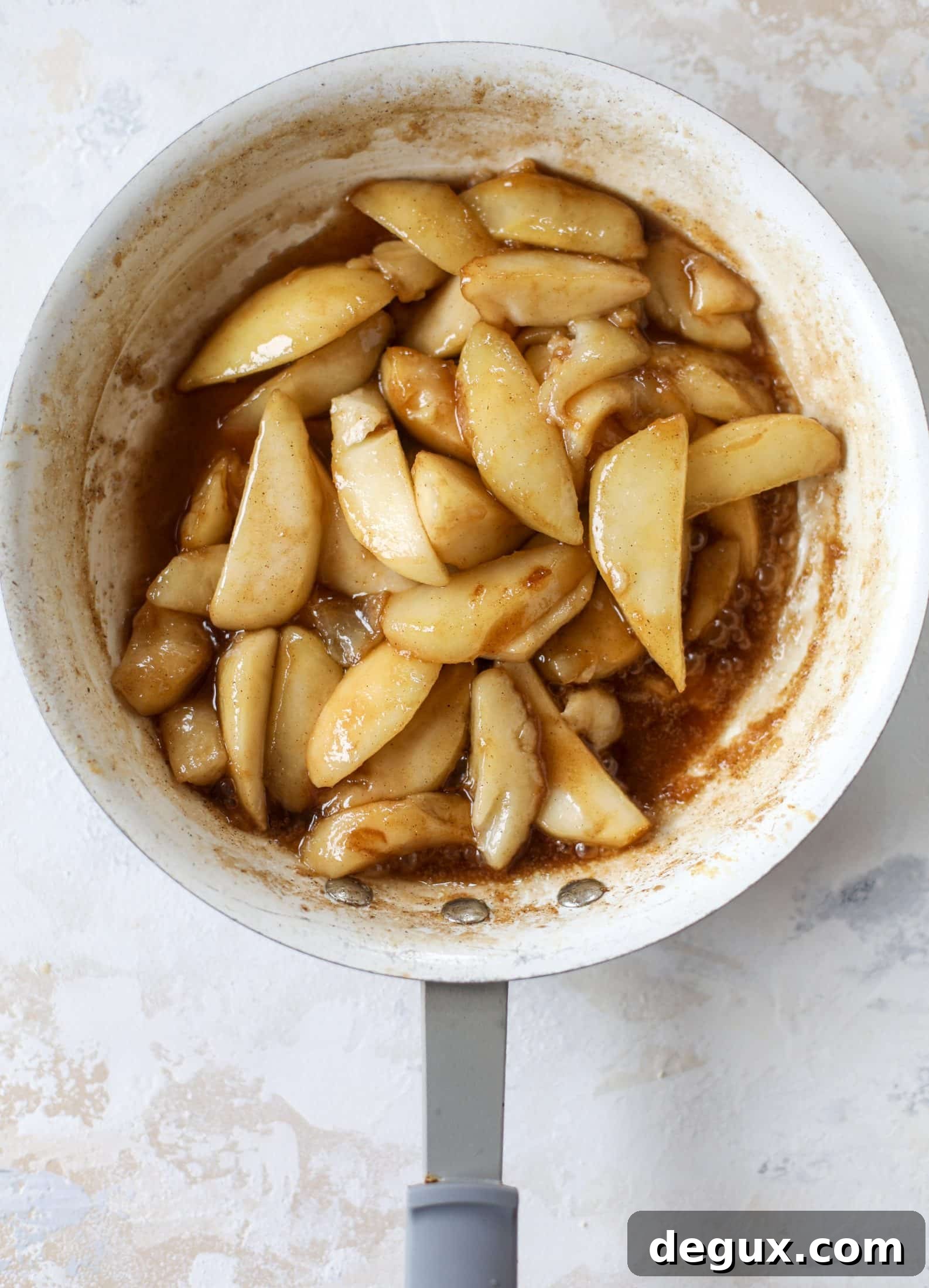 Pear mug pie served with vanilla ice cream and puff pastry stars.
