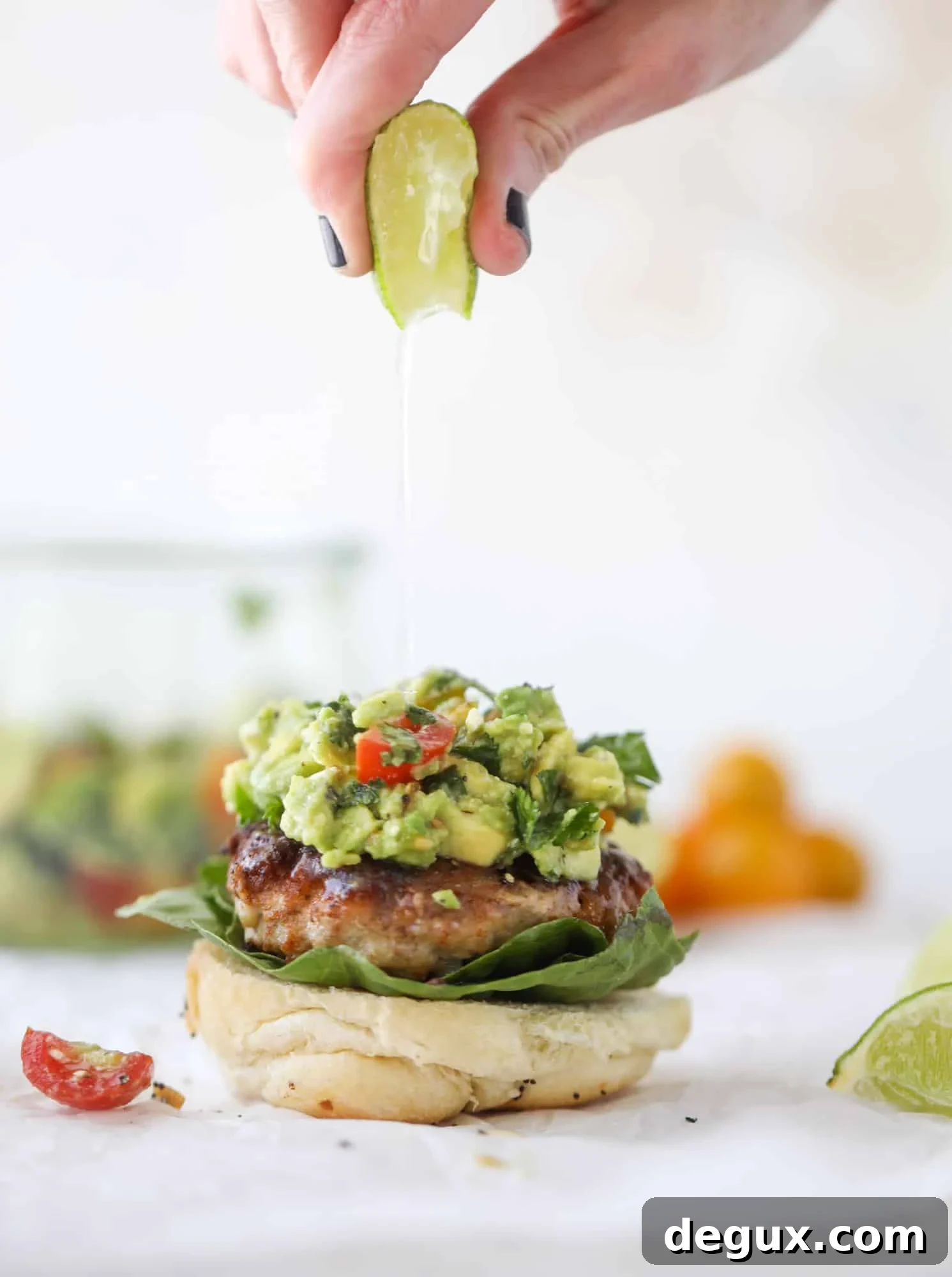 Guacamole-Stuffed Turkey Burgers with Lime Cilantro Flavor 4 These turkey burgers are full of flavor and topped with a delicious chunky guacamole to take the flavor over the top. The perfect easy dinner! I howsweeteats.com #turkey #burgers