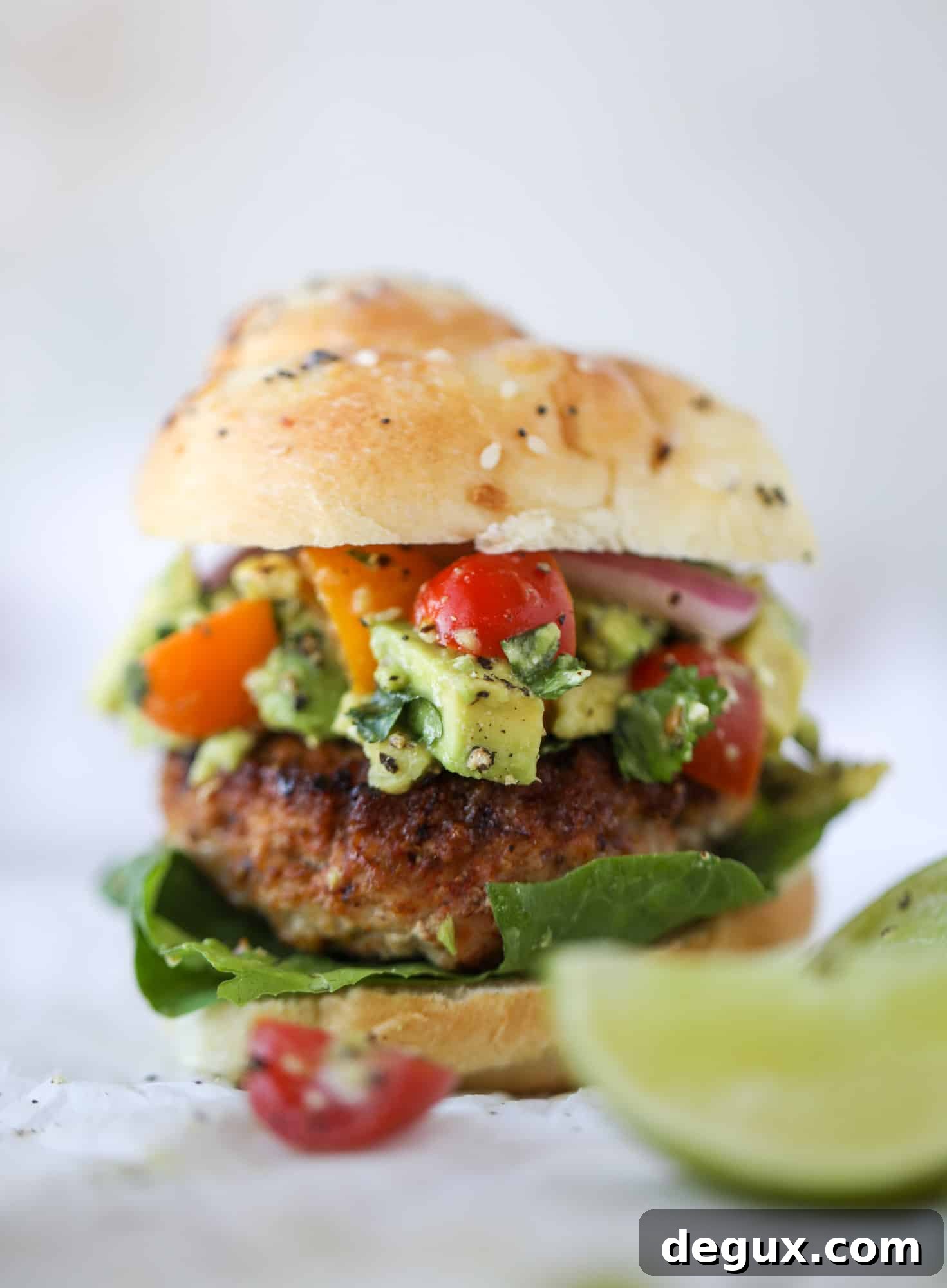 Guacamole-Stuffed Turkey Burgers with Lime Cilantro Flavor 8 These turkey burgers are full of flavor and topped with a delicious chunky guacamole to take the flavor over the top. The perfect easy dinner! I howsweeteats.com #turkey #burgers