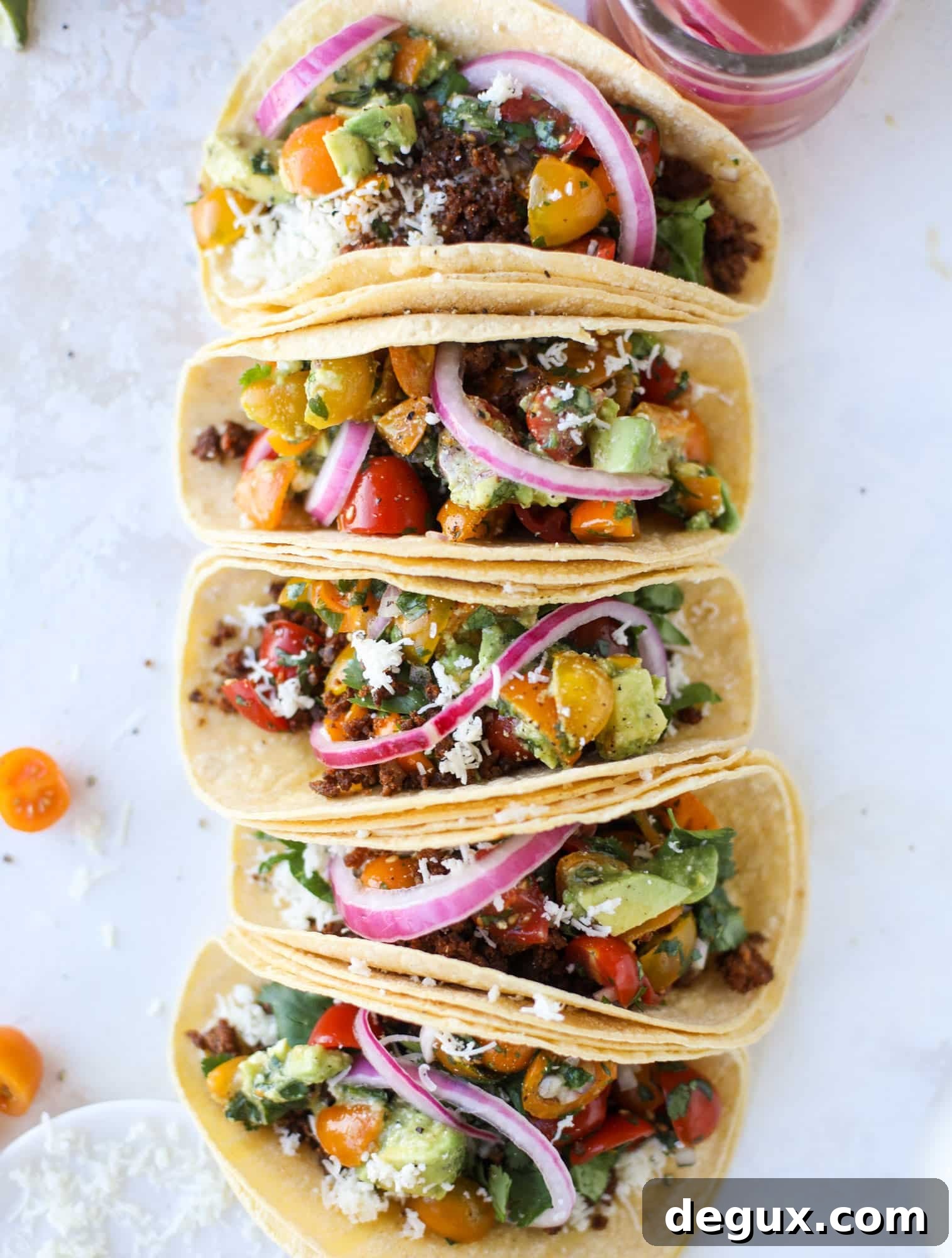 Weeknight ground beef tacos that are anything like the 90s! These are made with a homemade taco seasoning and served with the perfect toppings!