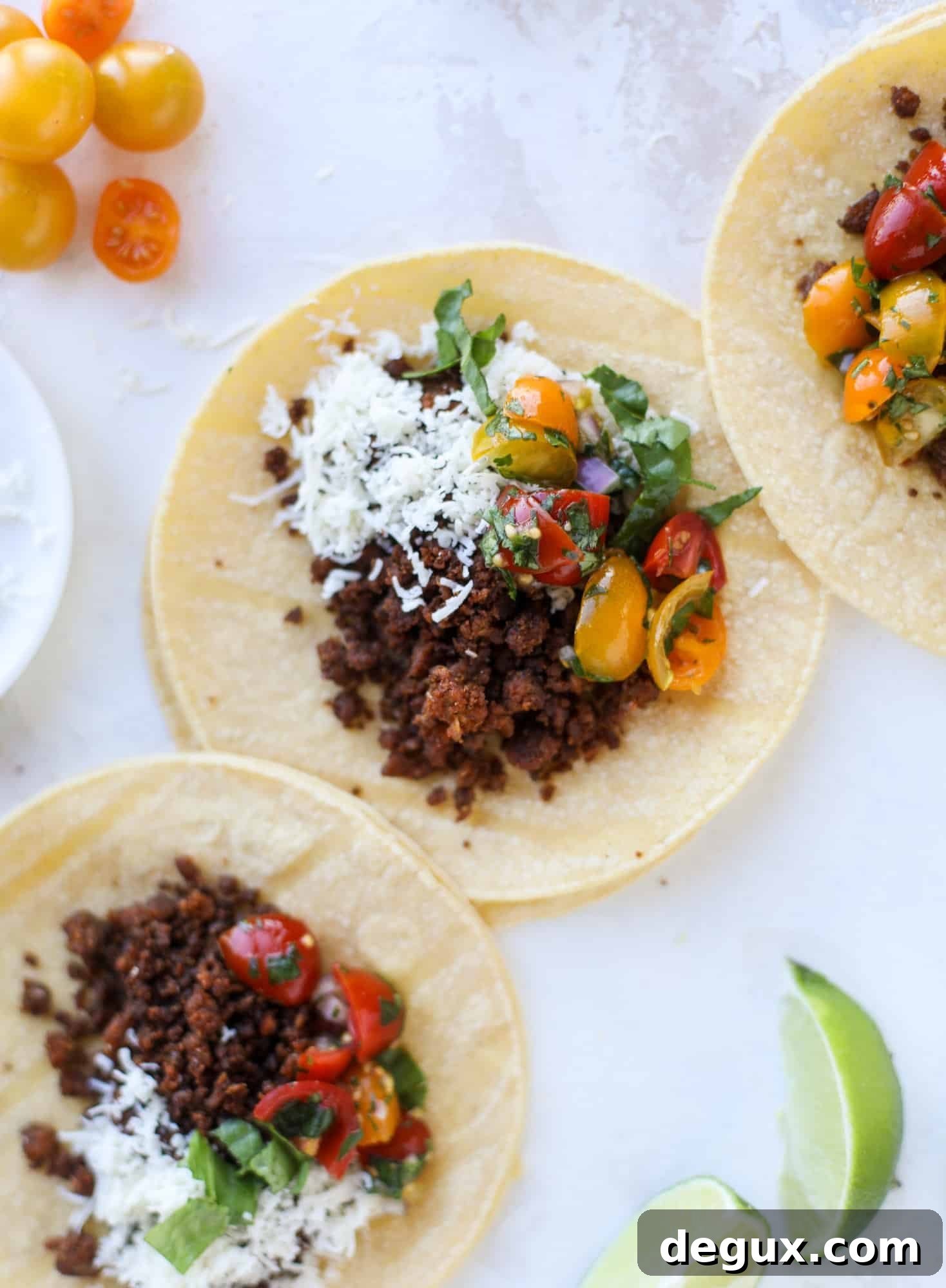 Weeknight ground beef tacos that are anything like the 90s! These are made with a homemade taco seasoning and served with the perfect toppings!
