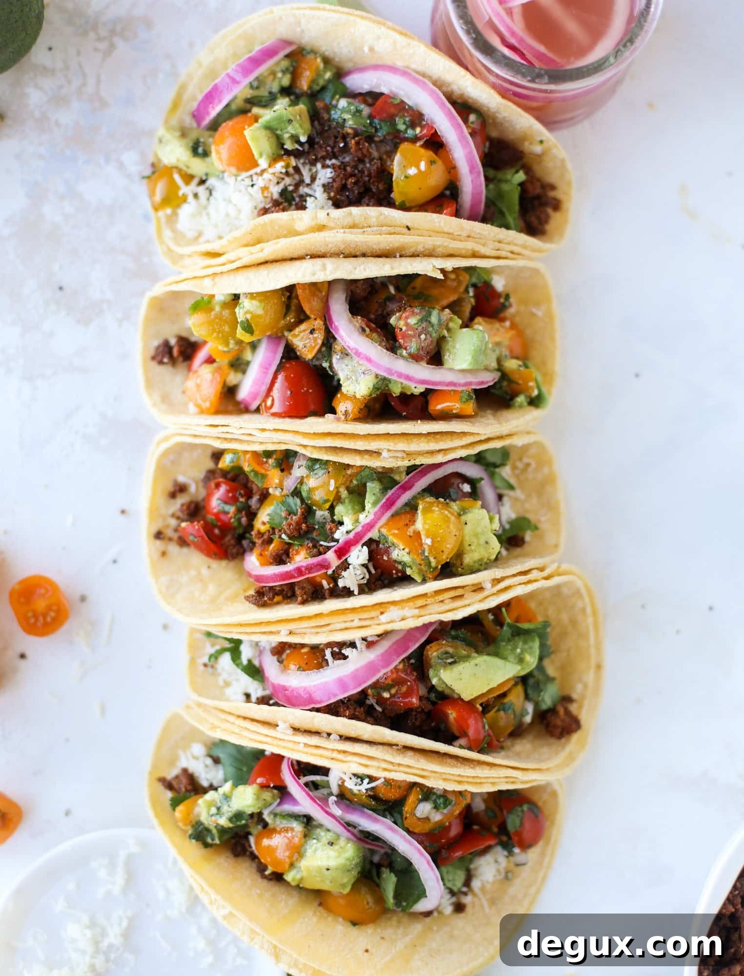Weeknight ground beef tacos that are anything like the 90s! These are made with a homemade taco seasoning and served with the perfect toppings!