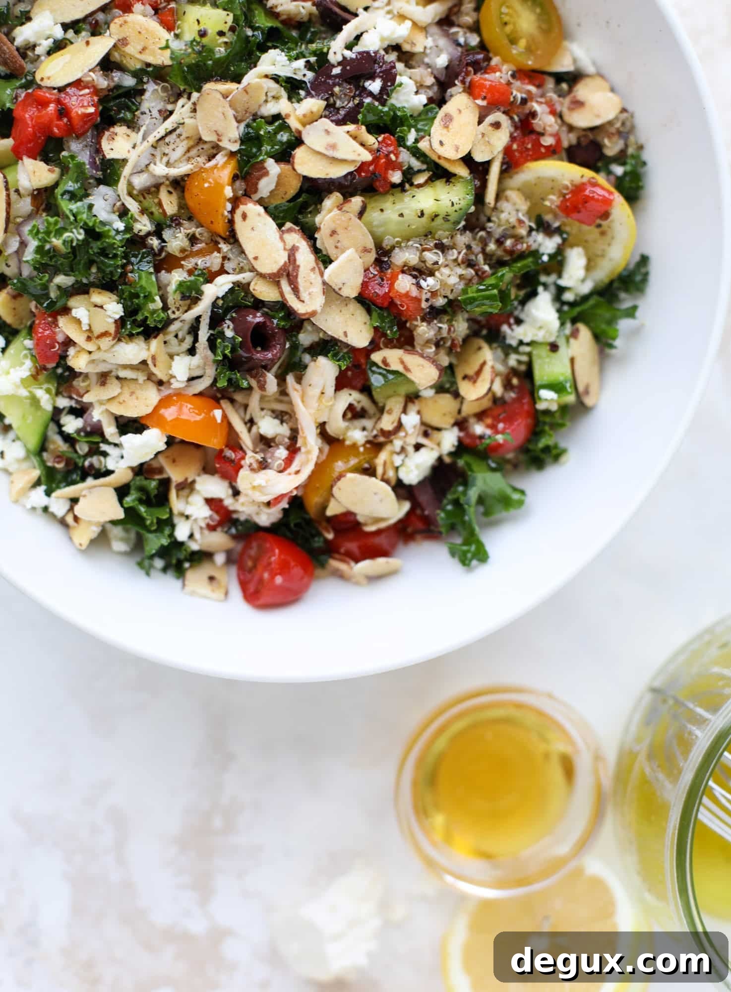 Mediterranean Kale and Quinoa Chicken Salad with Lemon Vinaigrette 5 This mediterranean kale and quinoa salad is a copycat for the delicious Panera Bread Modern Greek Salad with Chicken. Super easy and satisfying! I howsweeteats.com #mediterranean #kalesalad