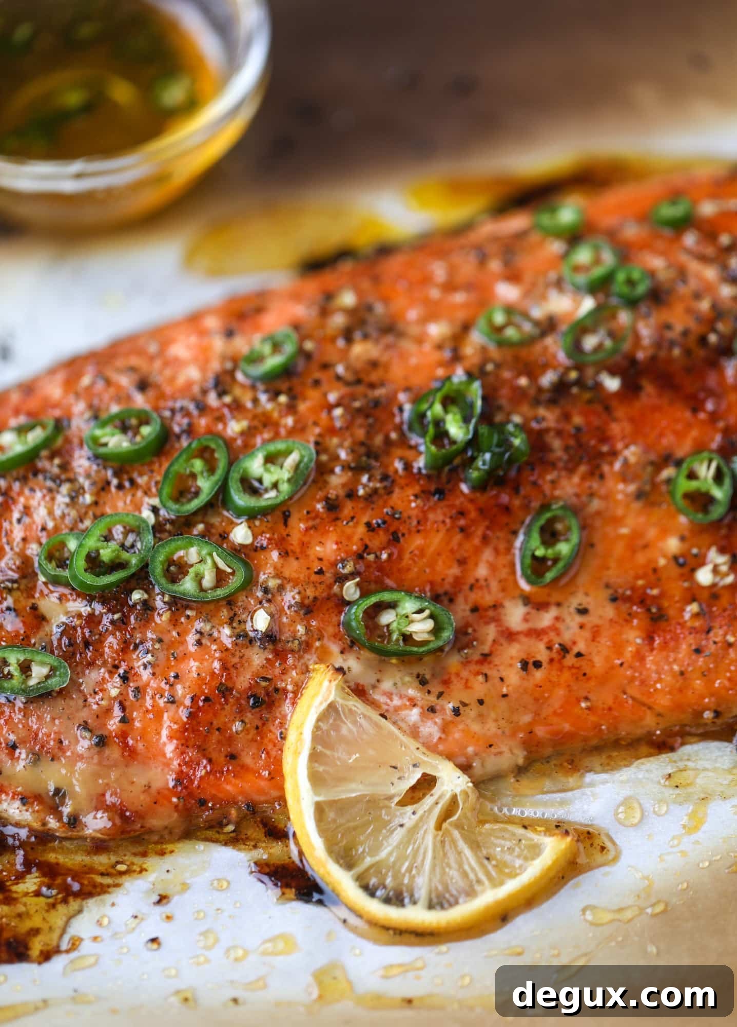 Spicy Honey-Glazed Roasted Salmon Recipe 2 This hot honey salmon is flaky and buttery with a hint of heat and a spritz of lemon. It's an easy weeknight meal and is delicious on salads for lunch!