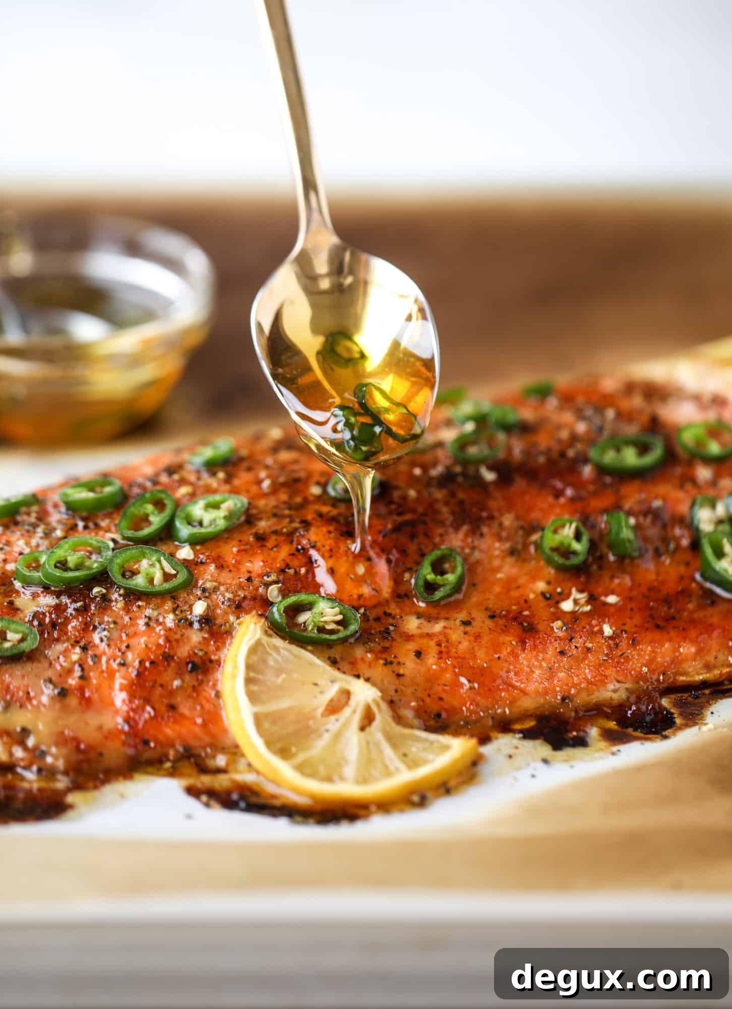 Spicy Honey-Glazed Roasted Salmon Recipe 7 This hot honey salmon is flaky and buttery with a hint of heat and a spritz of lemon. It's an easy weeknight meal and is delicious on salads for lunch!
