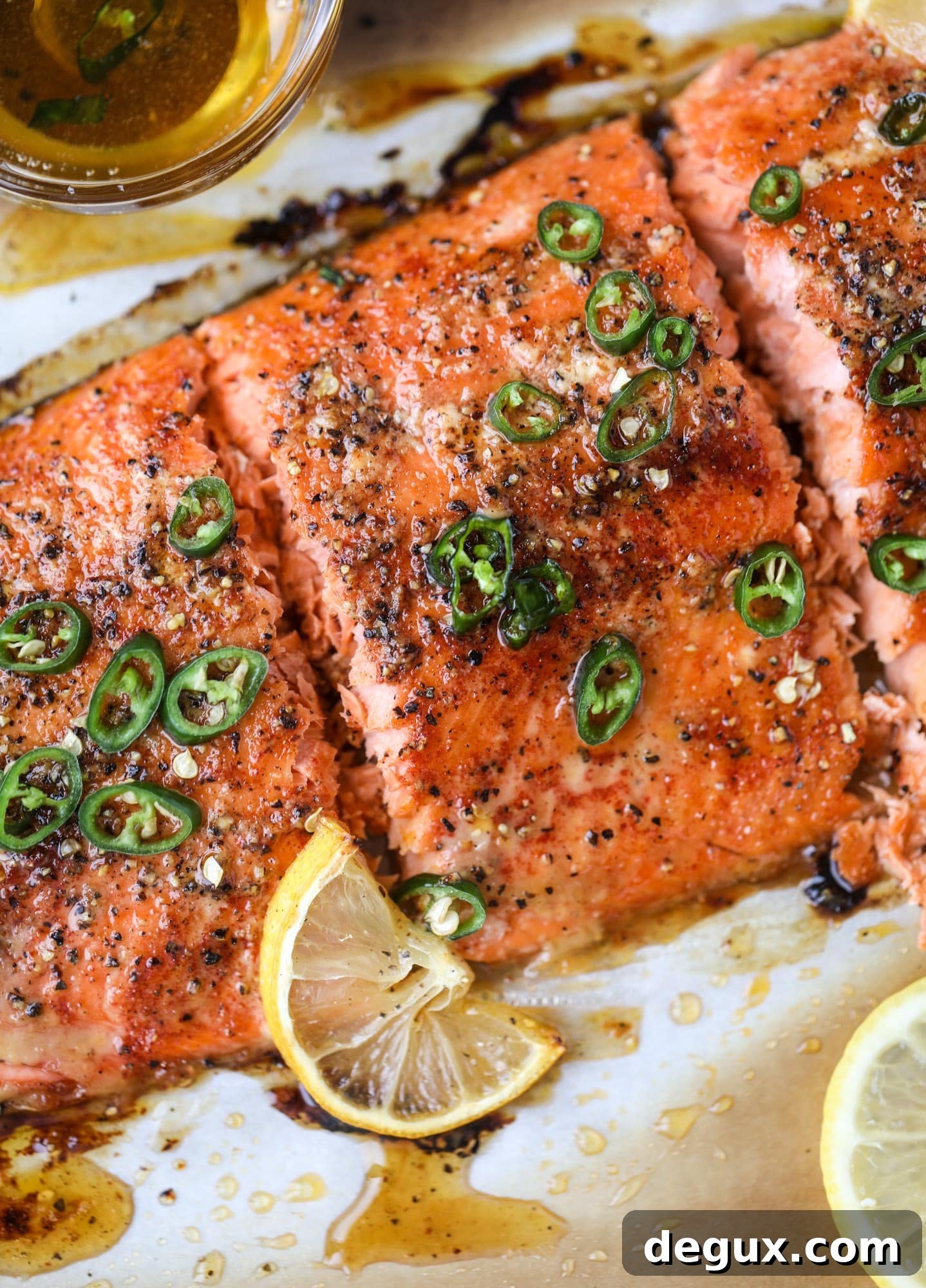 Spicy Honey-Glazed Roasted Salmon Recipe 9 This hot honey salmon is flaky and buttery with a hint of heat and a spritz of lemon. It's an easy weeknight meal and is delicious on salads for lunch!