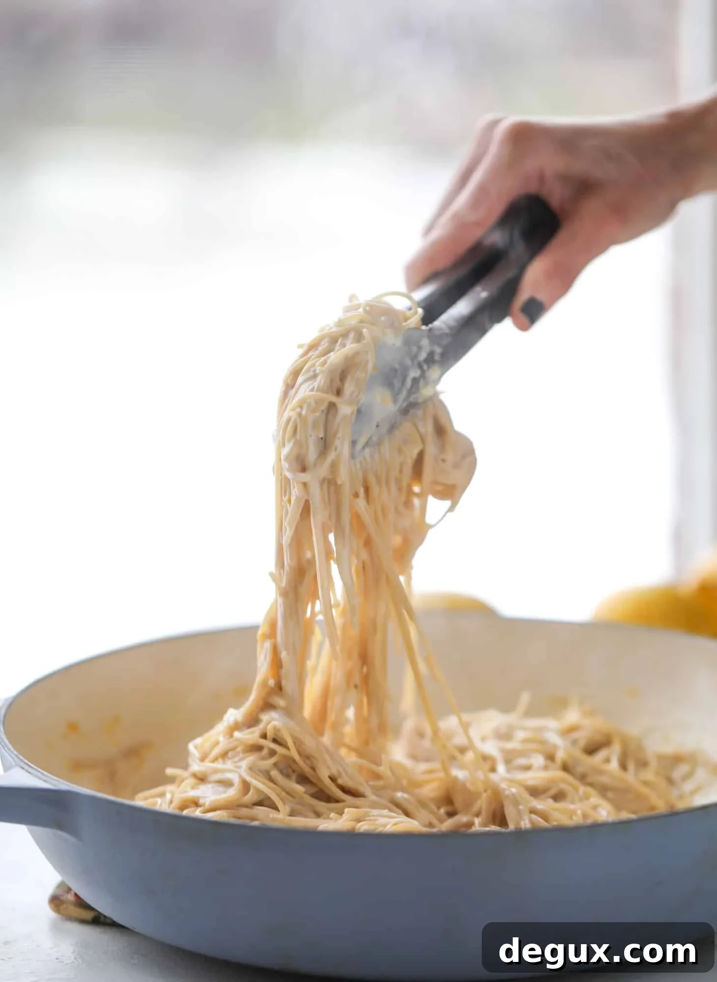 This cozy lemon pasta is light, refreshing and perfect for dinner when paired with a simple greens salad. It comes together in 20 minutes! I howsweeteats.com #lemon #pasta