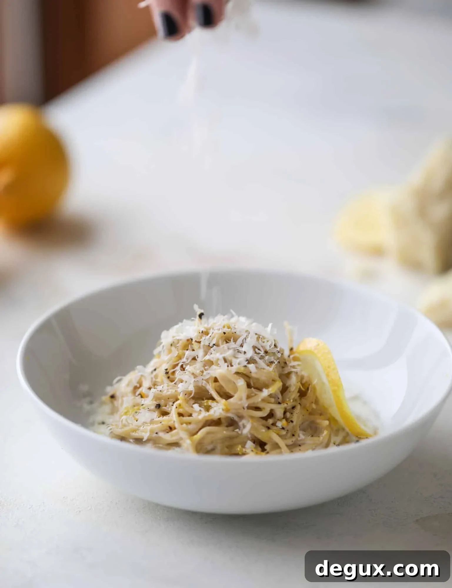This cozy lemon pasta is light, refreshing and perfect for dinner when paired with a simple greens salad. It comes together in 20 minutes! I howsweeteats.com #lemon #pasta