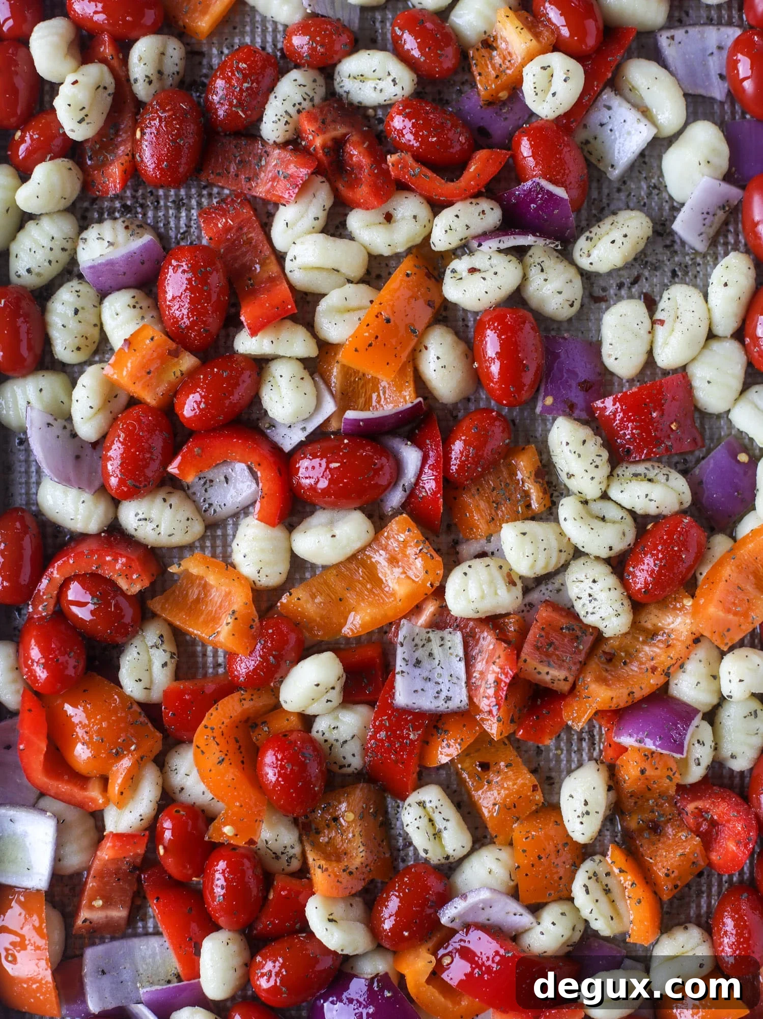 Sheet Pan Gnocchi with Roasted Vegetables and Garlic-Parmesan 3 Sheet pan gnocchi is an easy meal that the whole family will love! Toasted gnocchi along with burst tomatoes and caramelized peppers makes the best dinner. I howsweeteats.com #sheetpan #gnocchi