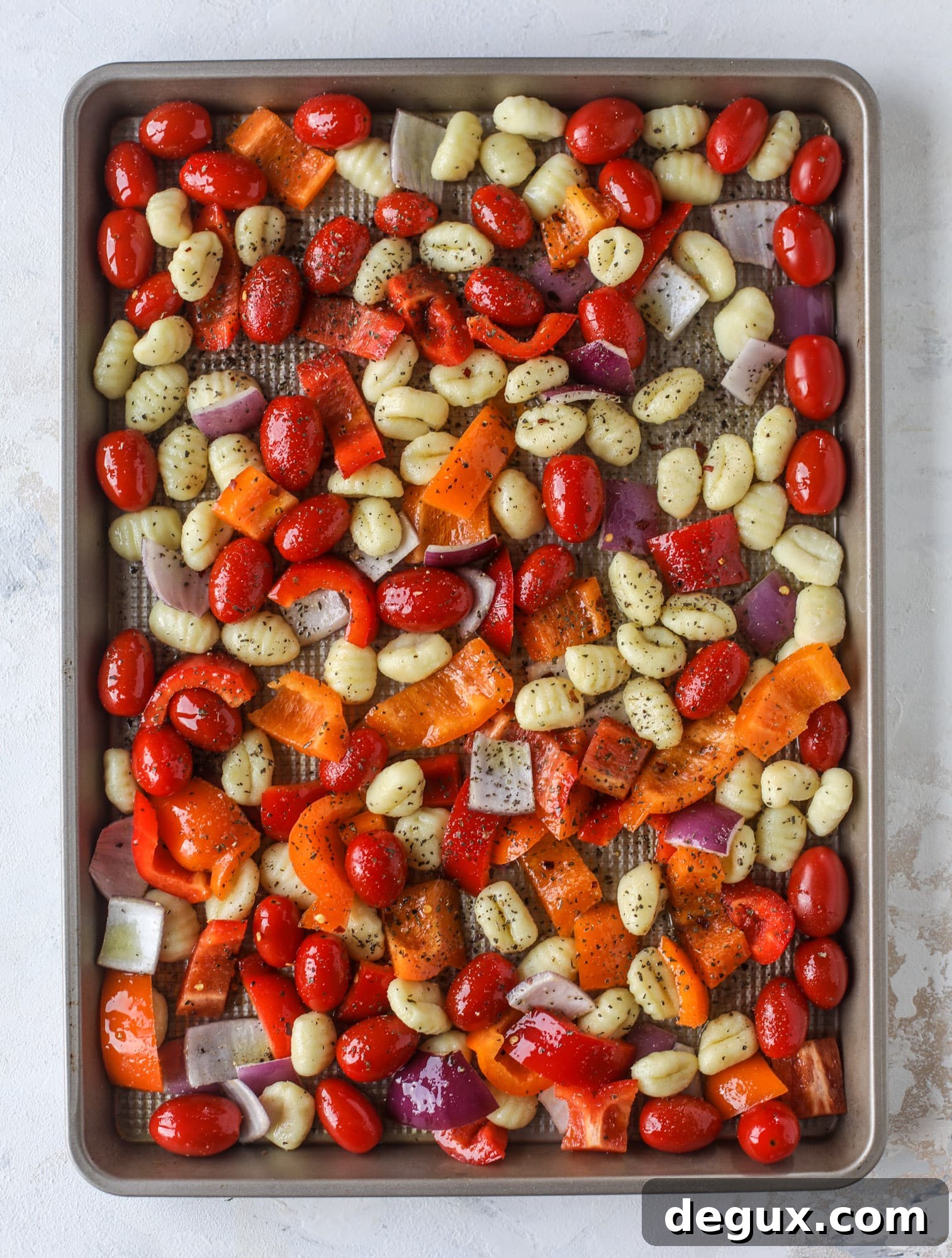 Sheet Pan Gnocchi with Roasted Vegetables and Garlic-Parmesan 4 Sheet pan gnocchi is an easy meal that the whole family will love! Toasted gnocchi along with burst tomatoes and caramelized peppers makes the best dinner. I howsweeteats.com #sheetpan #gnocchi