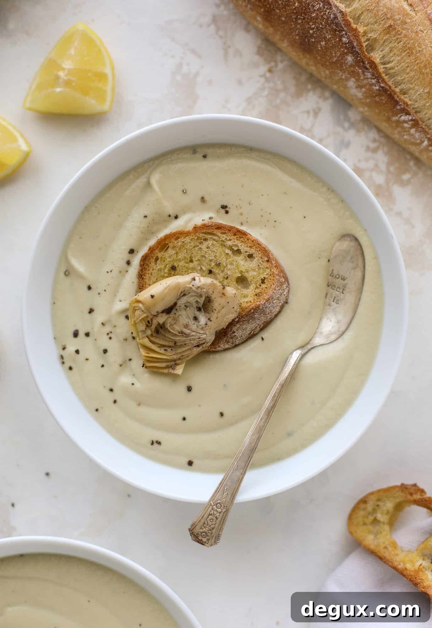 This creamy artichoke soup is full of artichoke hearts, cream and crème fraiche. It's rich and hearty but also light in flavor - perfect for late winter.