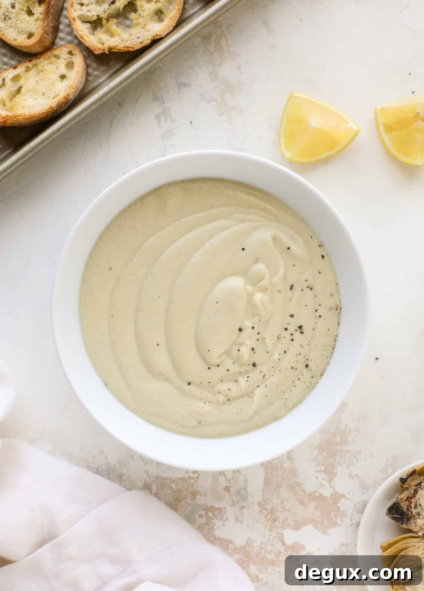 This creamy artichoke soup is full of artichoke hearts, cream and crème fraiche. It's rich and hearty but also light in flavor - perfect for late winter.
