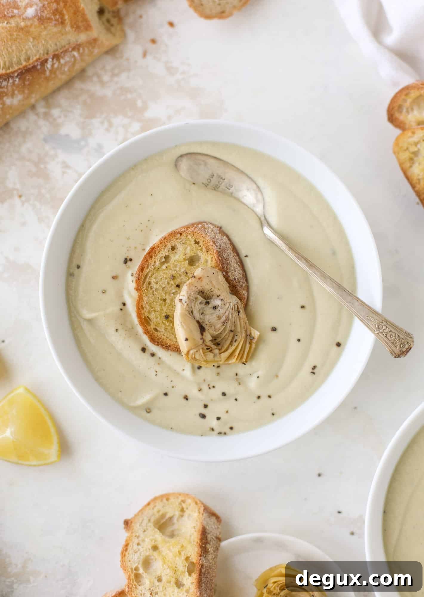 This creamy artichoke soup is full of artichoke hearts, cream and crème fraiche. It's rich and hearty but also light in flavor - perfect for late winter.