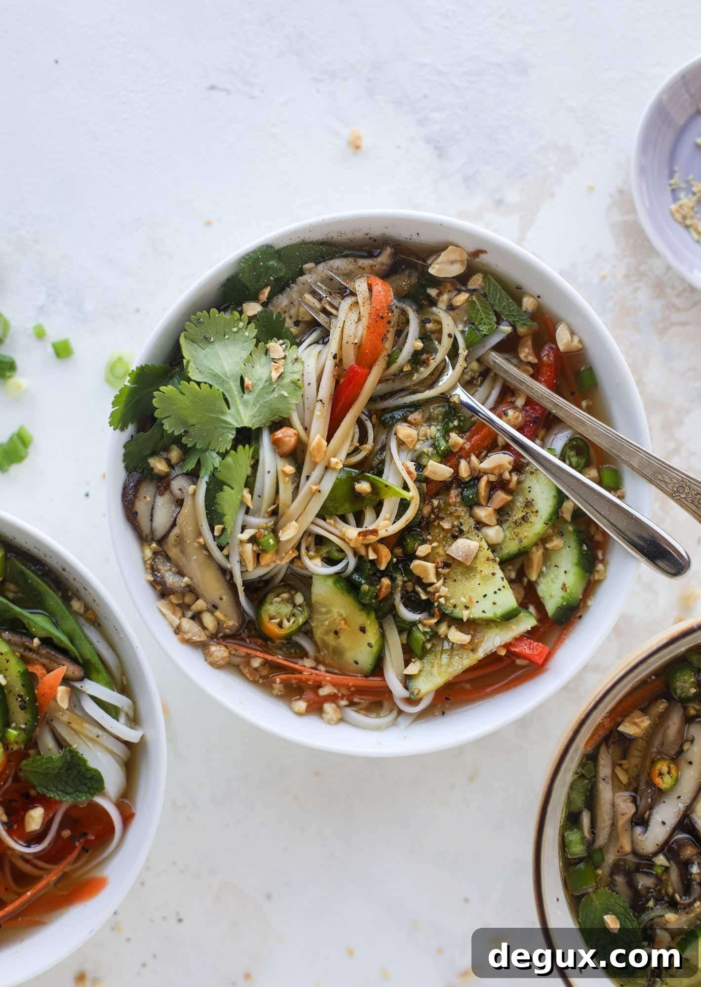 Ginger scallion noodle bowls are a flavorful, comforting vegetarian meal that can be customized to include any veggies you love! I howsweeteats.com #noodle #bowls