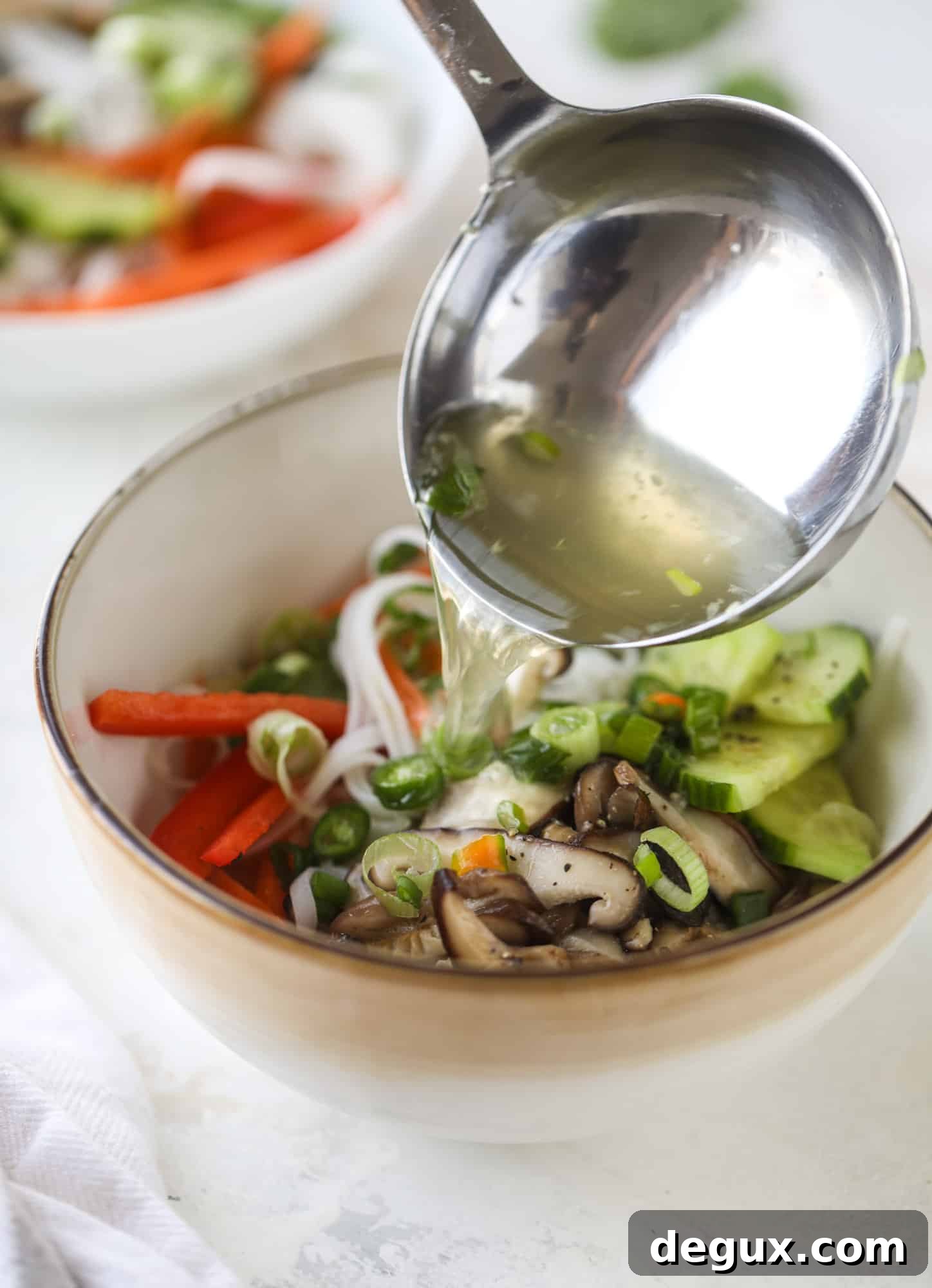 Ginger scallion noodle bowls are a flavorful, comforting vegetarian meal that can be customized to include any veggies you love! I howsweeteats.com #noodle #bowls
