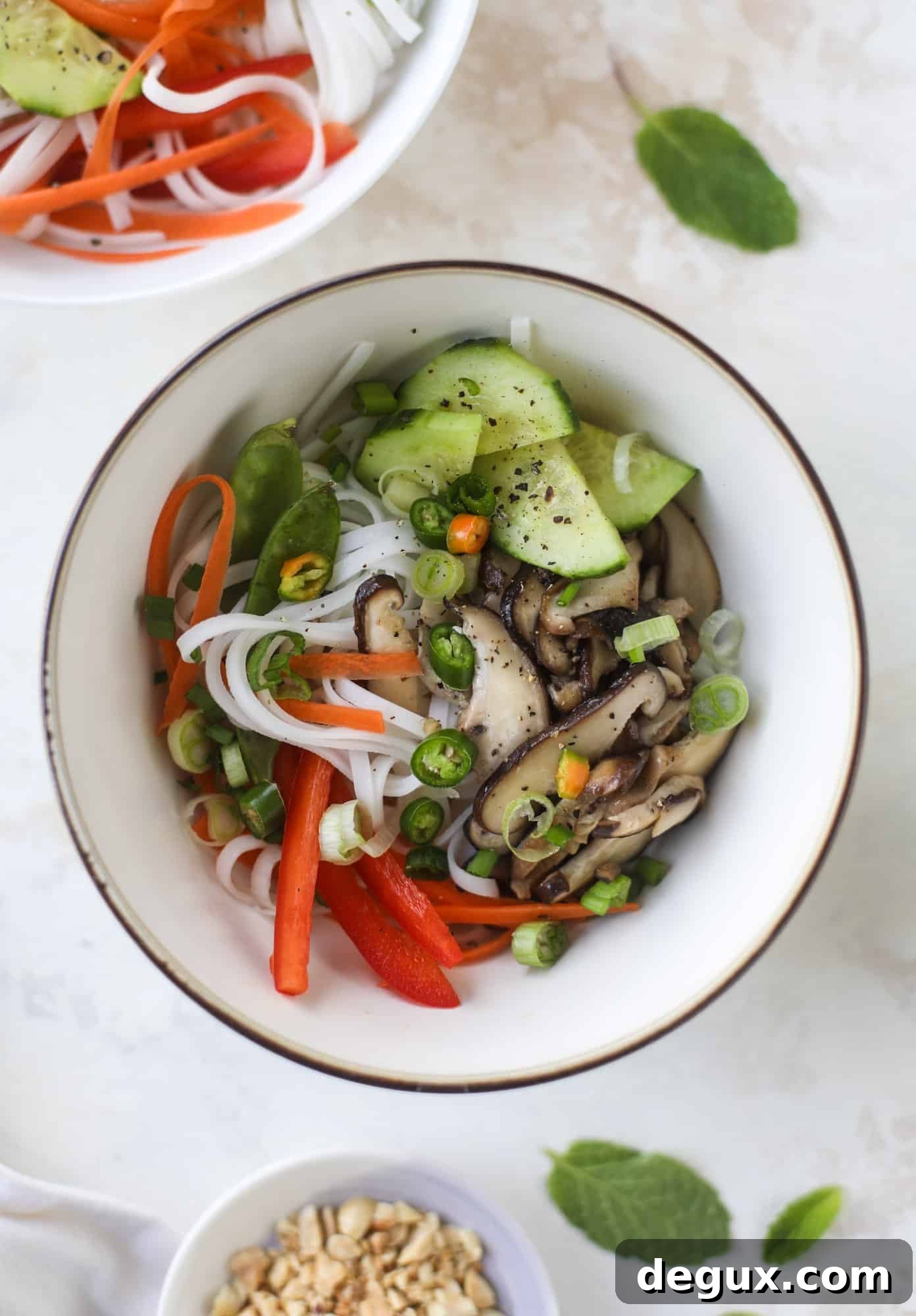 Ginger scallion noodle bowls are a flavorful, comforting vegetarian meal that can be customized to include any veggies you love! I howsweeteats.com #noodle #bowls
