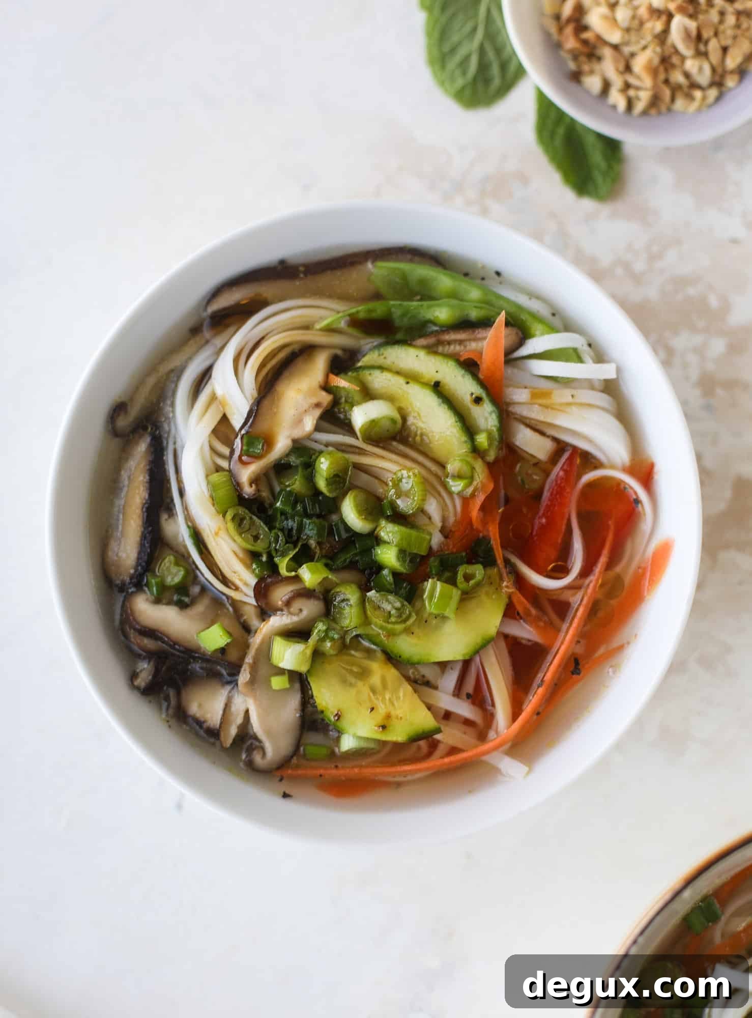 Ginger scallion noodle bowls are a flavorful, comforting vegetarian meal that can be customized to include any veggies you love! I howsweeteats.com #noodle #bowls