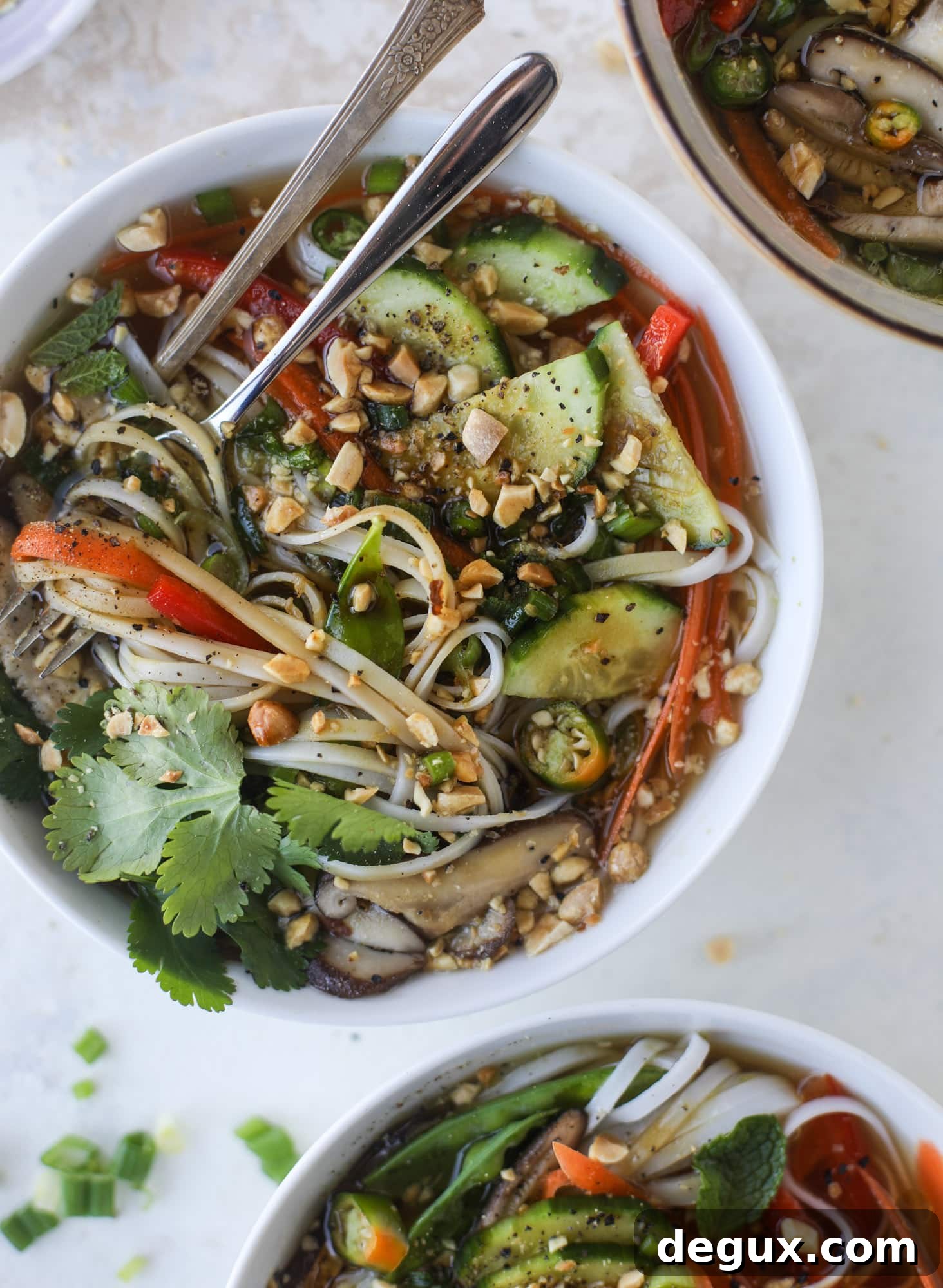 Ginger scallion noodle bowls are a flavorful, comforting vegetarian meal that can be customized to include any veggies you love! I howsweeteats.com #noodle #bowls