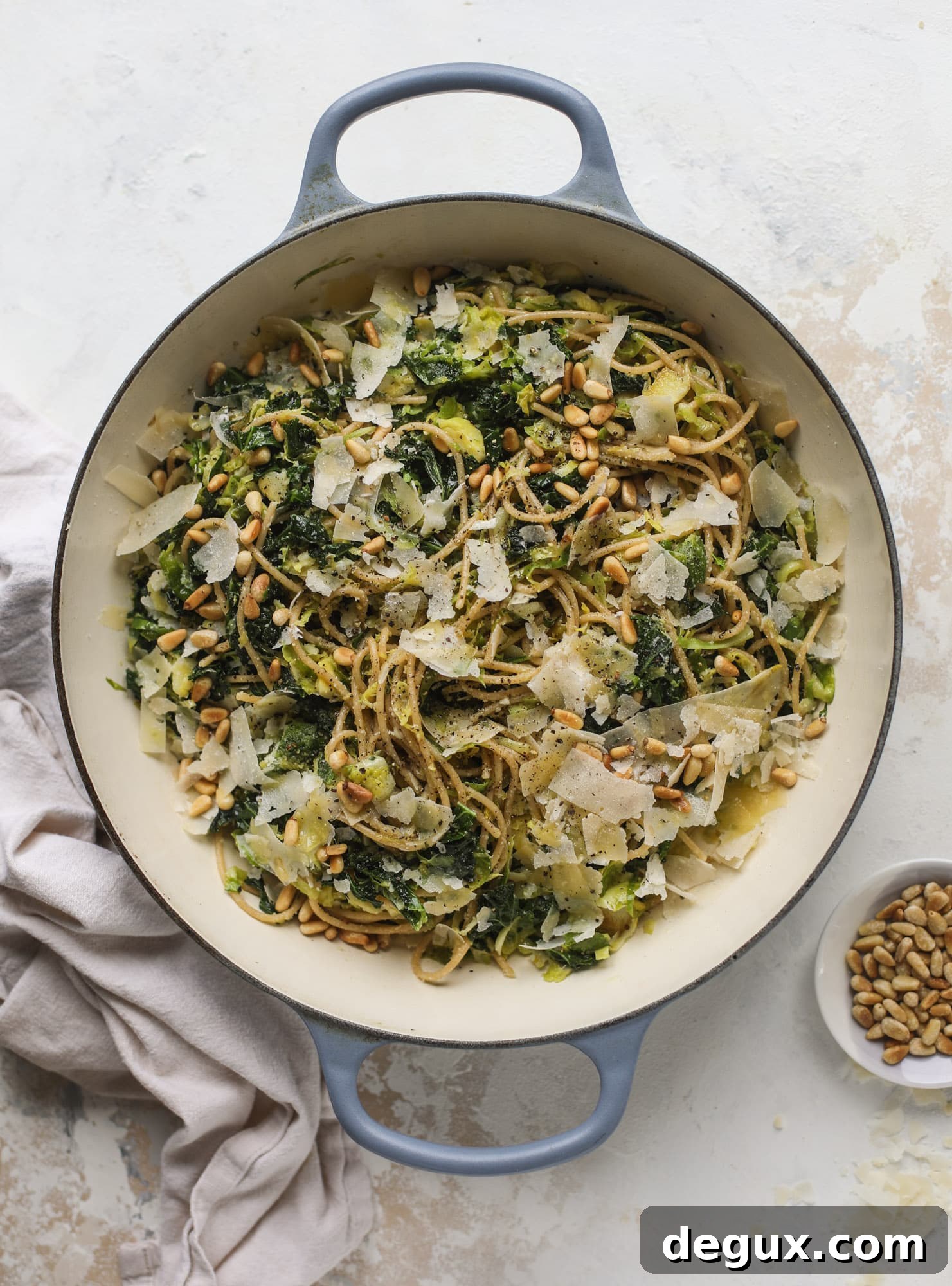 Brussels Sprouts and Kale Spaghetti with Parmesan & Pine Nuts 4 This brussels spaghetti with kale, parmesan and pine nuts is a super flavorful, quick and easy weeknight meal. You can add in a protein if you wish! I howsweeteats.com #brussels #spaghetti