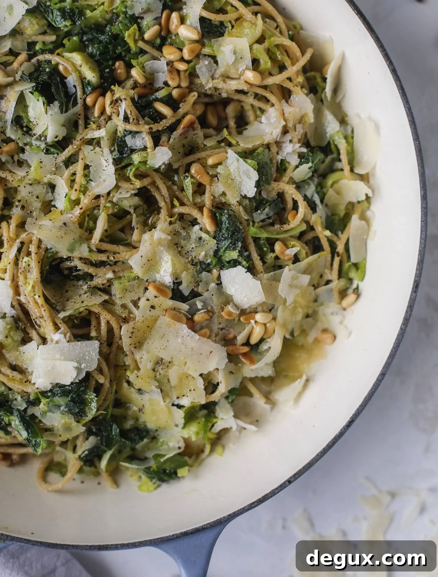 Brussels Sprouts and Kale Spaghetti with Parmesan & Pine Nuts 5 This brussels spaghetti with kale, parmesan and pine nuts is a super flavorful, quick and easy weeknight meal. You can add in a protein if you wish! I howsweeteats.com #brussels #spaghetti