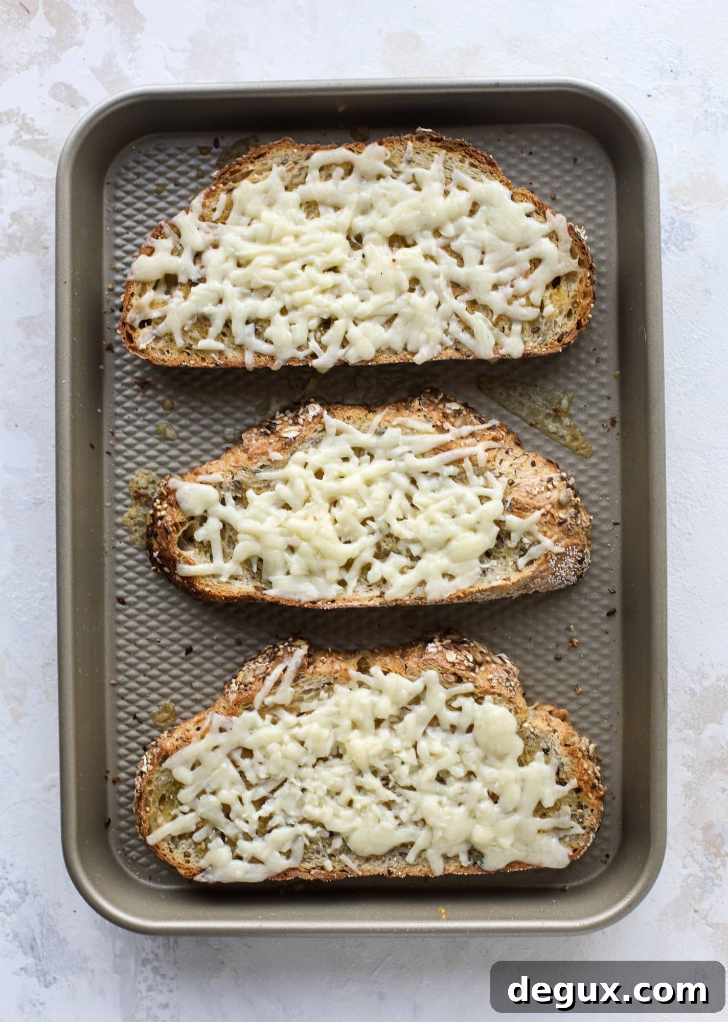 Crispy brussels sprouts toast begins with sourdough bread, melty havarti cheese and caramelized onions. It's high-maintenance toast in the best way possible. I howsweeteats.com