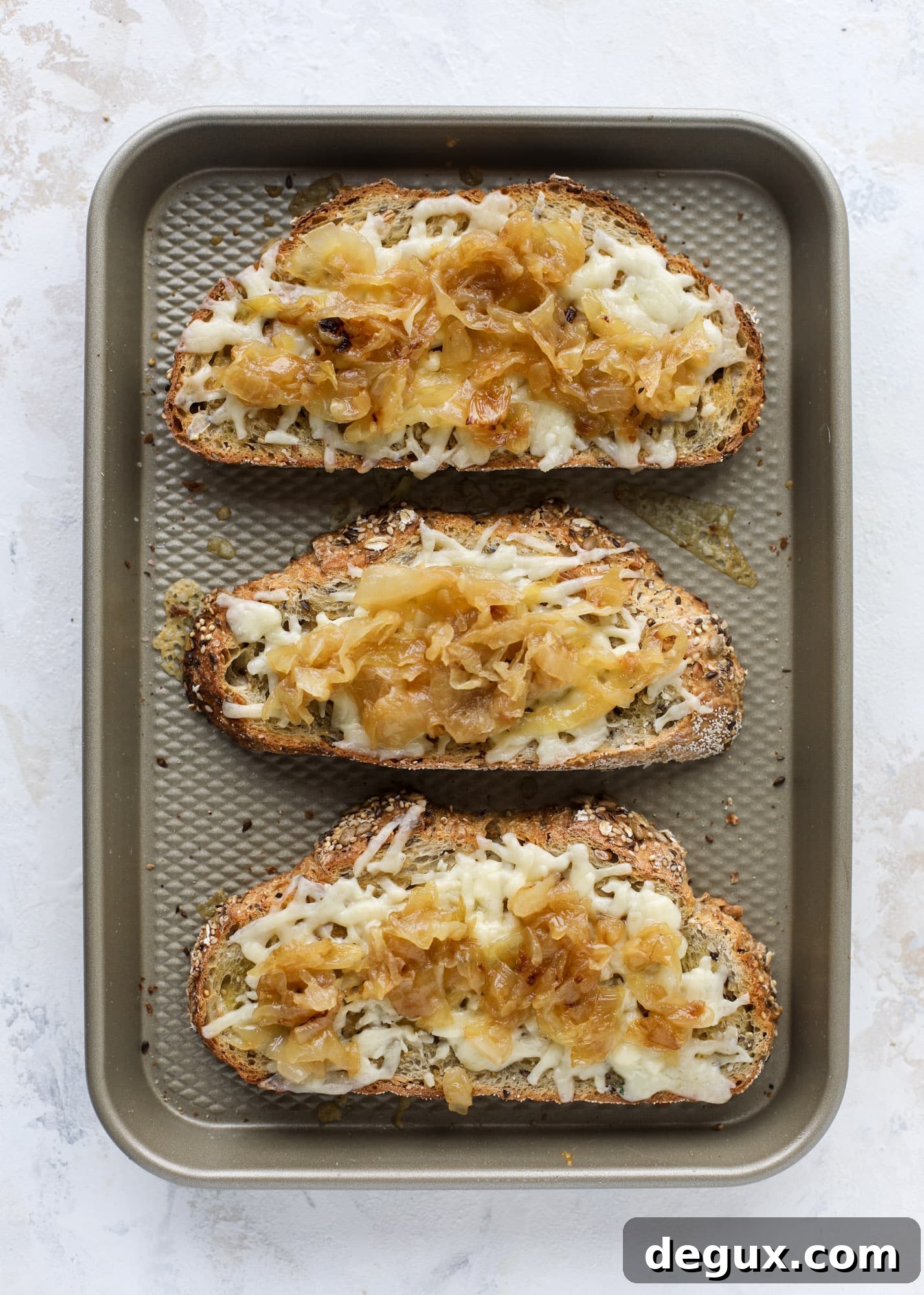 Crispy brussels sprouts toast begins with sourdough bread, melty havarti cheese and caramelized onions. It's high-maintenance toast in the best way possible. I howsweeteats.com