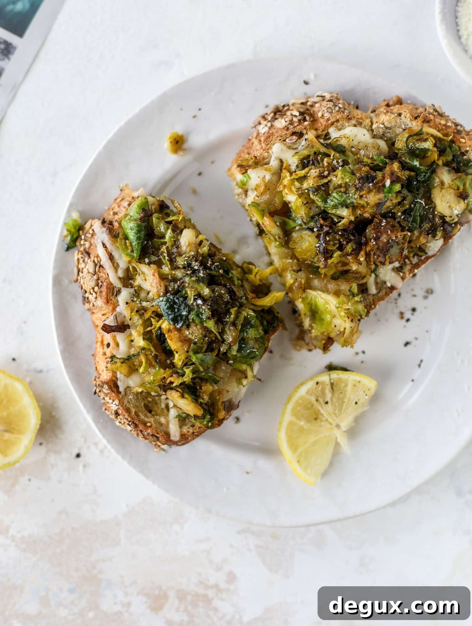 Crispy brussels sprouts toast begins with sourdough bread, melty havarti cheese and caramelized onions. It's high-maintenance toast in the best way possible. I howsweeteats.com