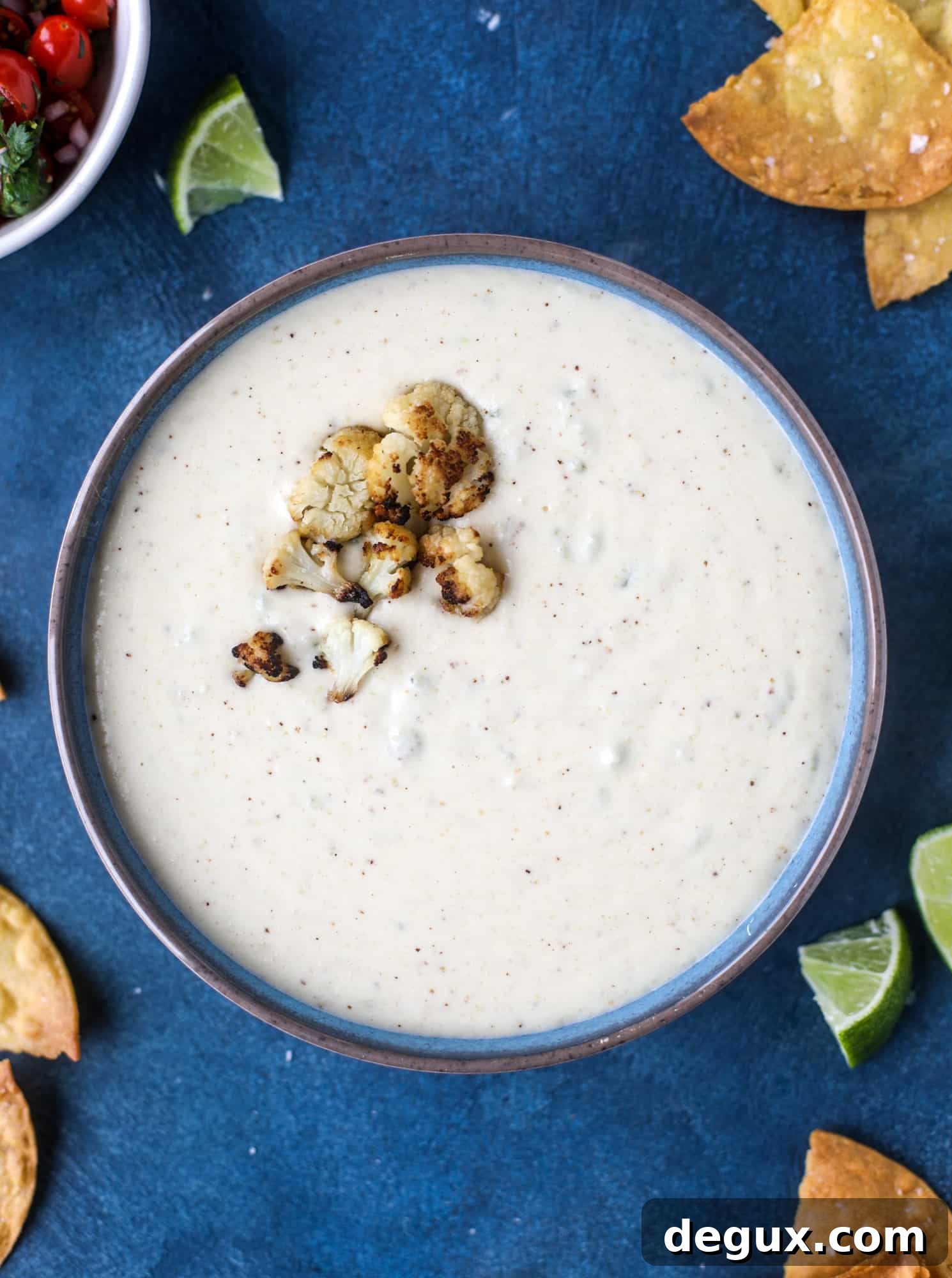 Roasted Cauliflower Queso Recipe: Creamy Vegan Dip for Parties 5 This roasted cauliflower queso has all the deliciousness of regular queso, with roasted cauliflower added in. It's satisfying and tastes like heaven. I howsweeteats.com #cauliflower #queso