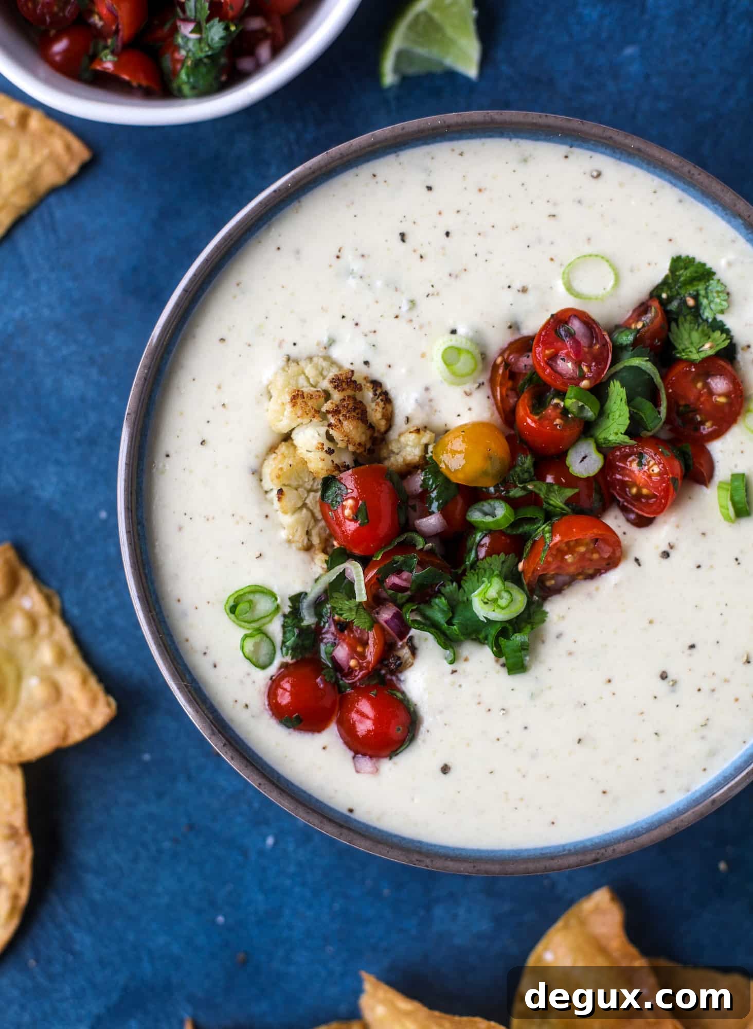 Roasted Cauliflower Queso Recipe: Creamy Vegan Dip for Parties 7 This roasted cauliflower queso has all the deliciousness of regular queso, with roasted cauliflower added in. It's satisfying and tastes like heaven. I howsweeteats.com #cauliflower #queso