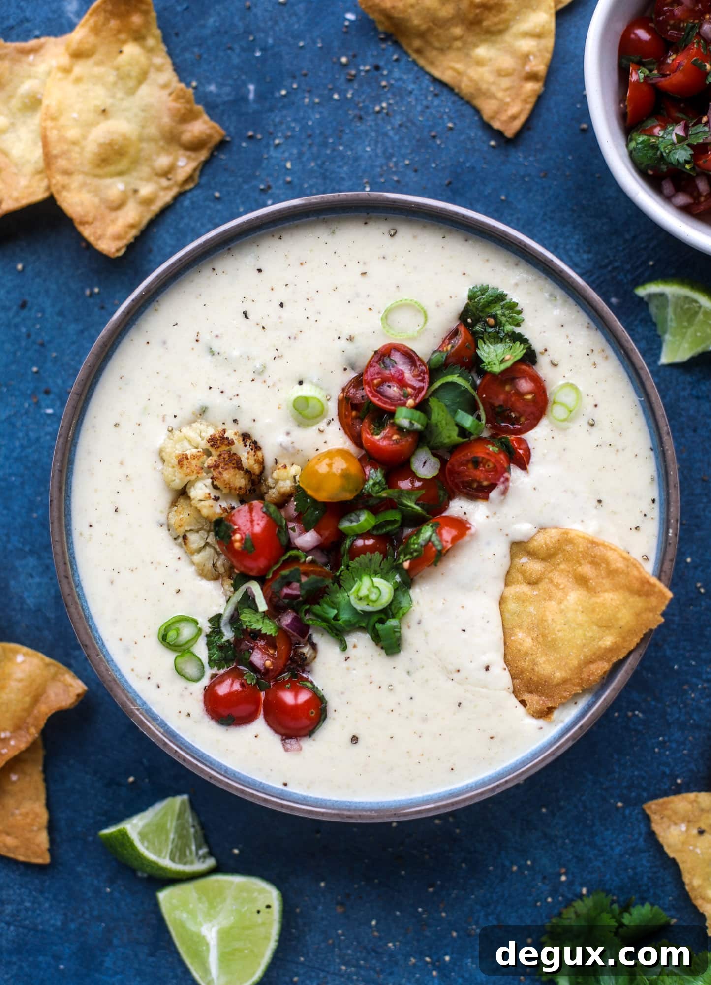 Roasted Cauliflower Queso Recipe: Creamy Vegan Dip for Parties 9 This roasted cauliflower queso has all the deliciousness of regular queso, with roasted cauliflower added in. It's satisfying and tastes like heaven. I howsweeteats.com #cauliflower #queso