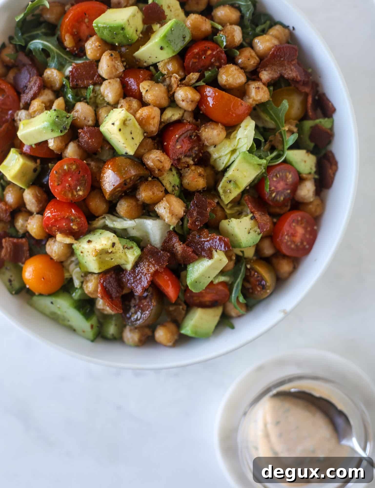 Chickpea Bacon Ranch Chopped Salad Recipe 5 The chickpea bacon ranch salad has a ton of crispy, crunchy texture and flavor. It's satisfying and super easy to prep ahead of time too! I howsweeteats.com #chickpea #salad