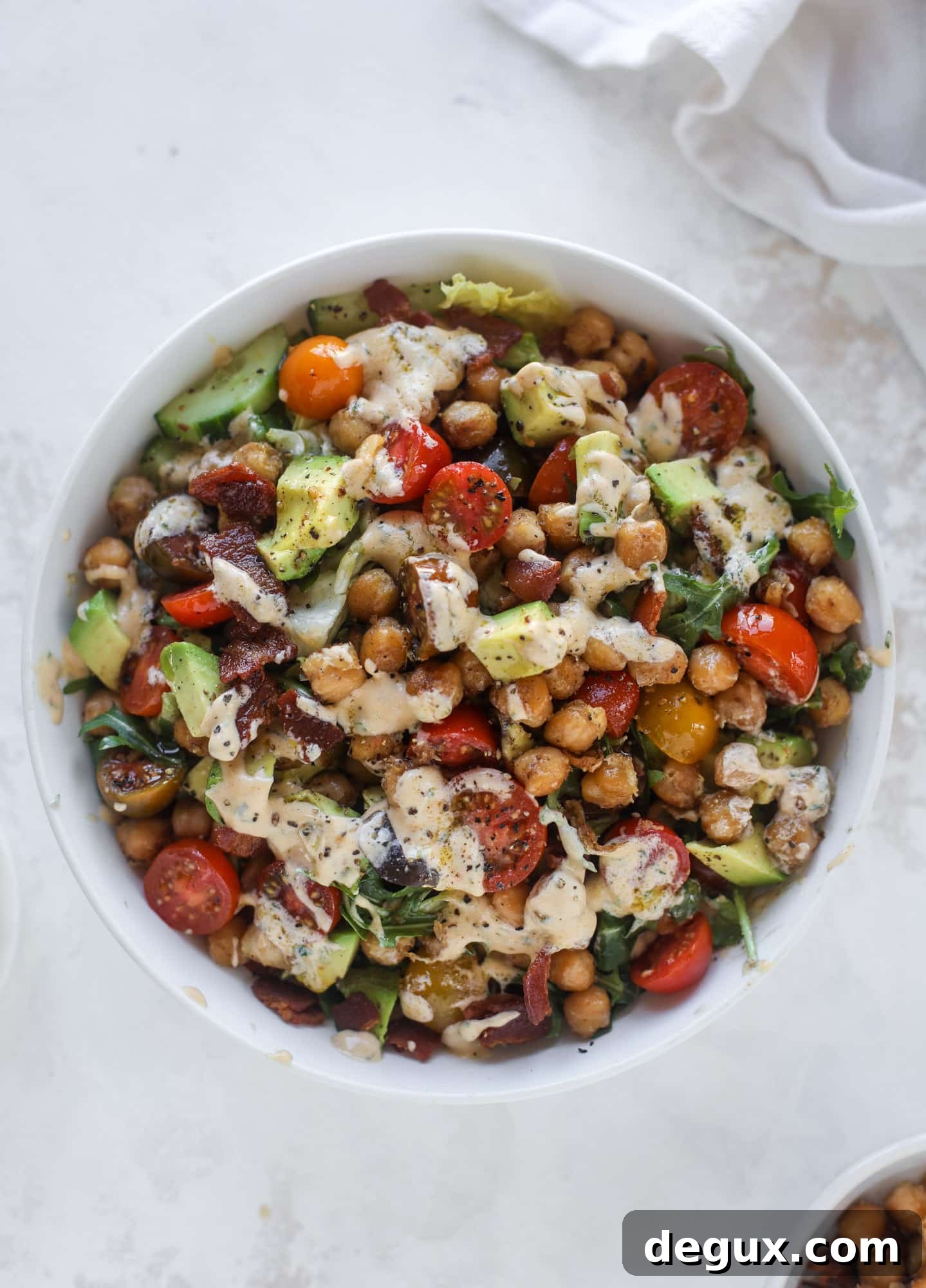 Chickpea Bacon Ranch Chopped Salad Recipe 6 The chickpea bacon ranch salad has a ton of crispy, crunchy texture and flavor. It's satisfying and super easy to prep ahead of time too! I howsweeteats.com #chickpea #salad
