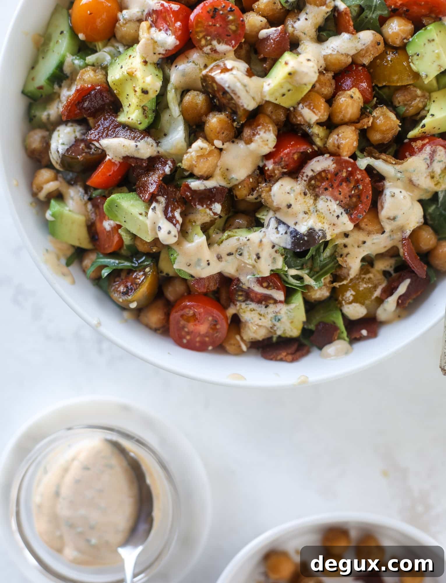 Chickpea Bacon Ranch Chopped Salad Recipe 7 The chickpea bacon ranch salad has a ton of crispy, crunchy texture and flavor. It's satisfying and super easy to prep ahead of time too! I howsweeteats.com #chickpea #salad