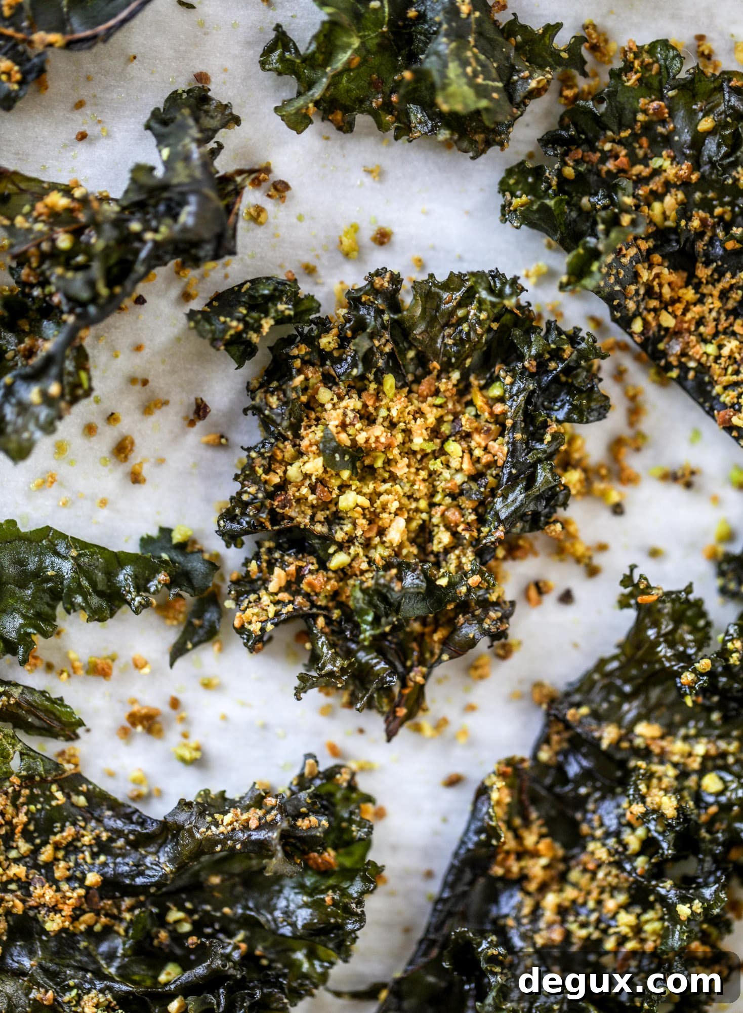 Parmesan Pistachio Kale Chips — Crispy Holiday Side Dish 7 Parmesan pistachio kale chips are an easy and healthy snack - full of nutty, cheesy flavor and crispy like regular chips!