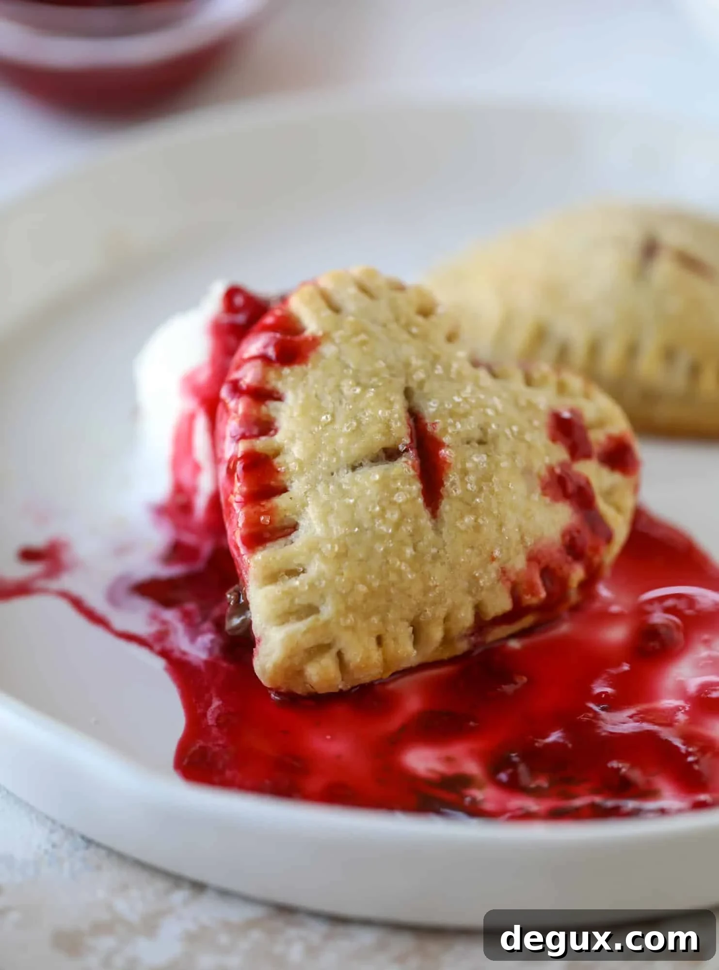 These adorable mini heart pies are filled with a homemade raspberry compote and creamy, chocolatey nutella. So fun and easy to make!