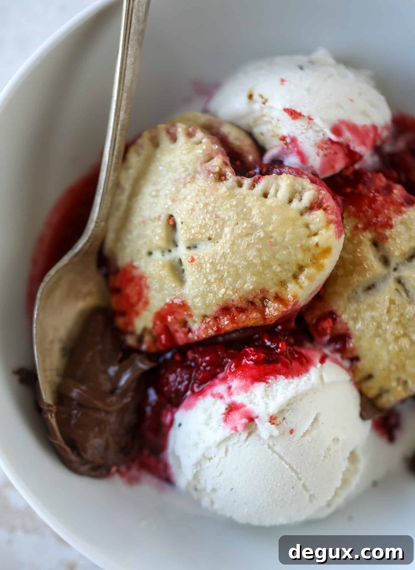 These adorable mini heart pies are filled with a homemade raspberry compote and creamy, chocolatey nutella. So fun and easy to make!