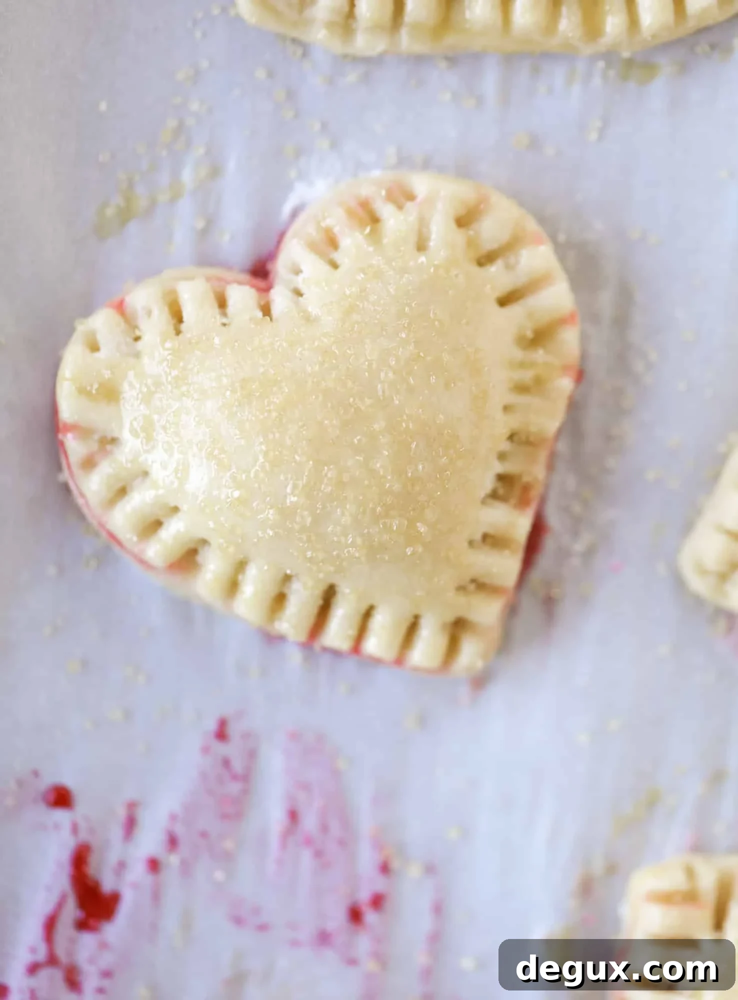 These adorable mini heart pies are filled with a homemade raspberry compote and creamy, chocolatey nutella. So fun and easy to make!