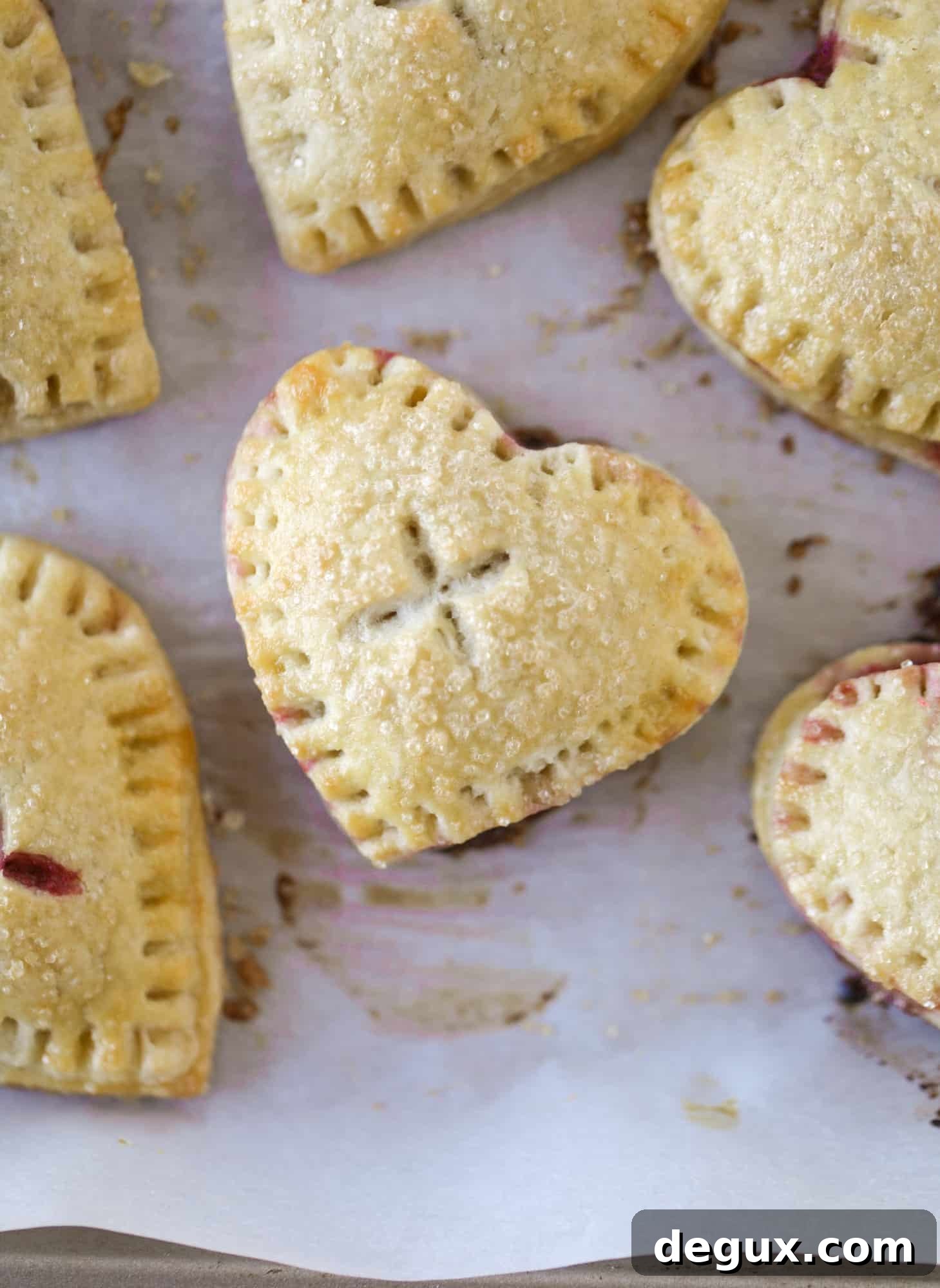 These adorable mini heart pies are filled with a homemade raspberry compote and creamy, chocolatey nutella. So fun and easy to make!