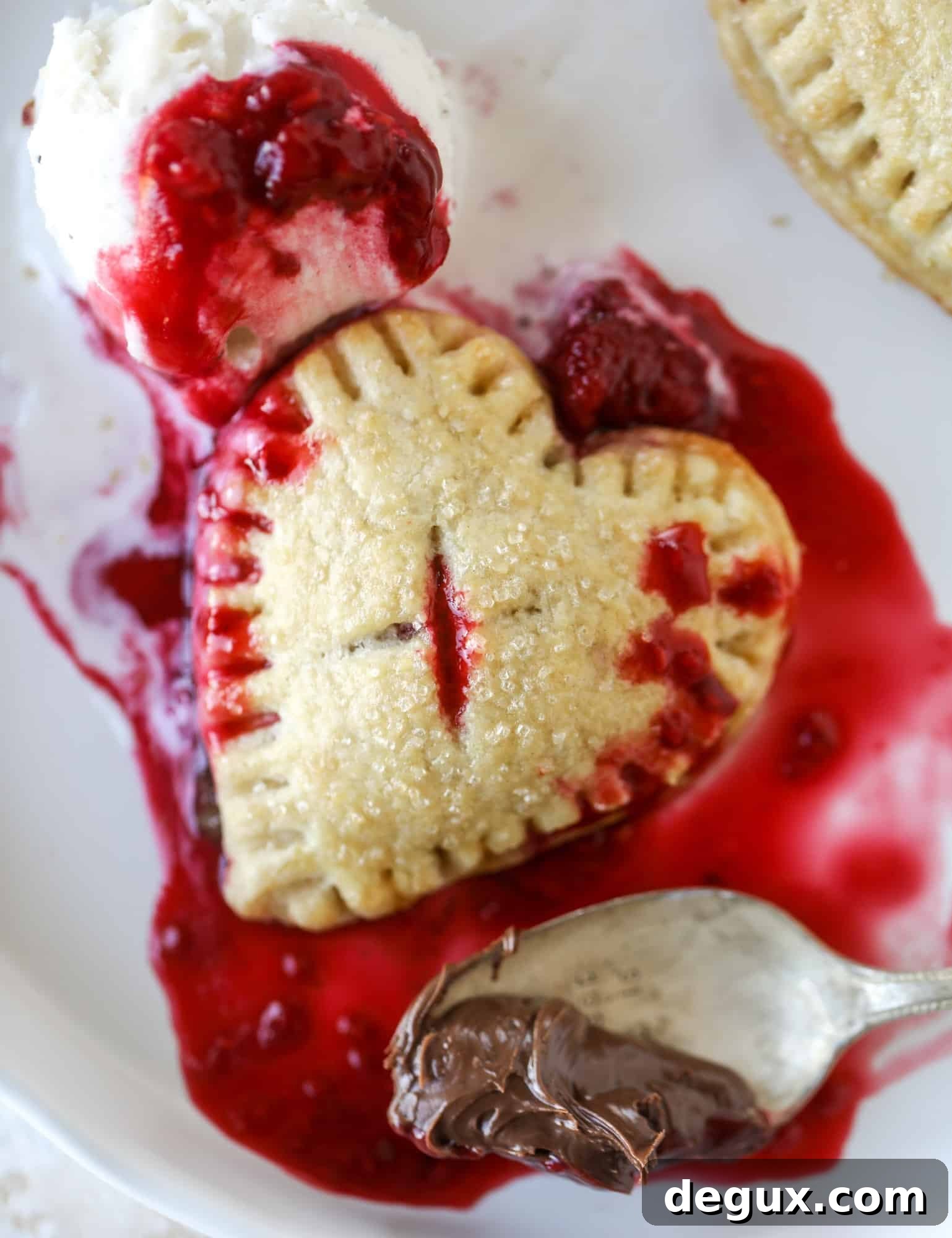 These adorable mini heart pies are filled with a homemade raspberry compote and creamy, chocolatey nutella. So fun and easy to make!