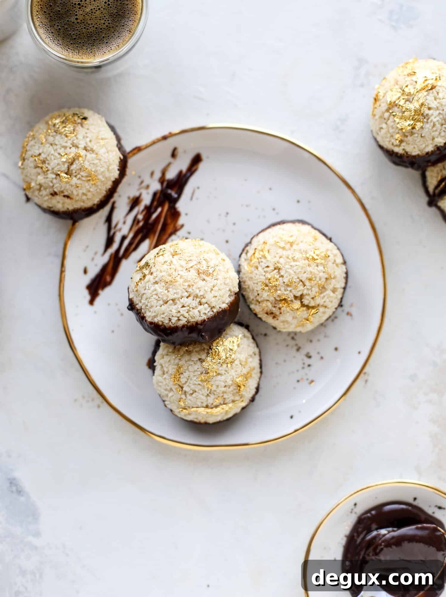 Classic chewy, slightly gooey coconut macaroons dipped in an irish cream chocolate ganache. Easy to make and gluten free too! I howsweeteats.com #irishcream #coconutmacaroons