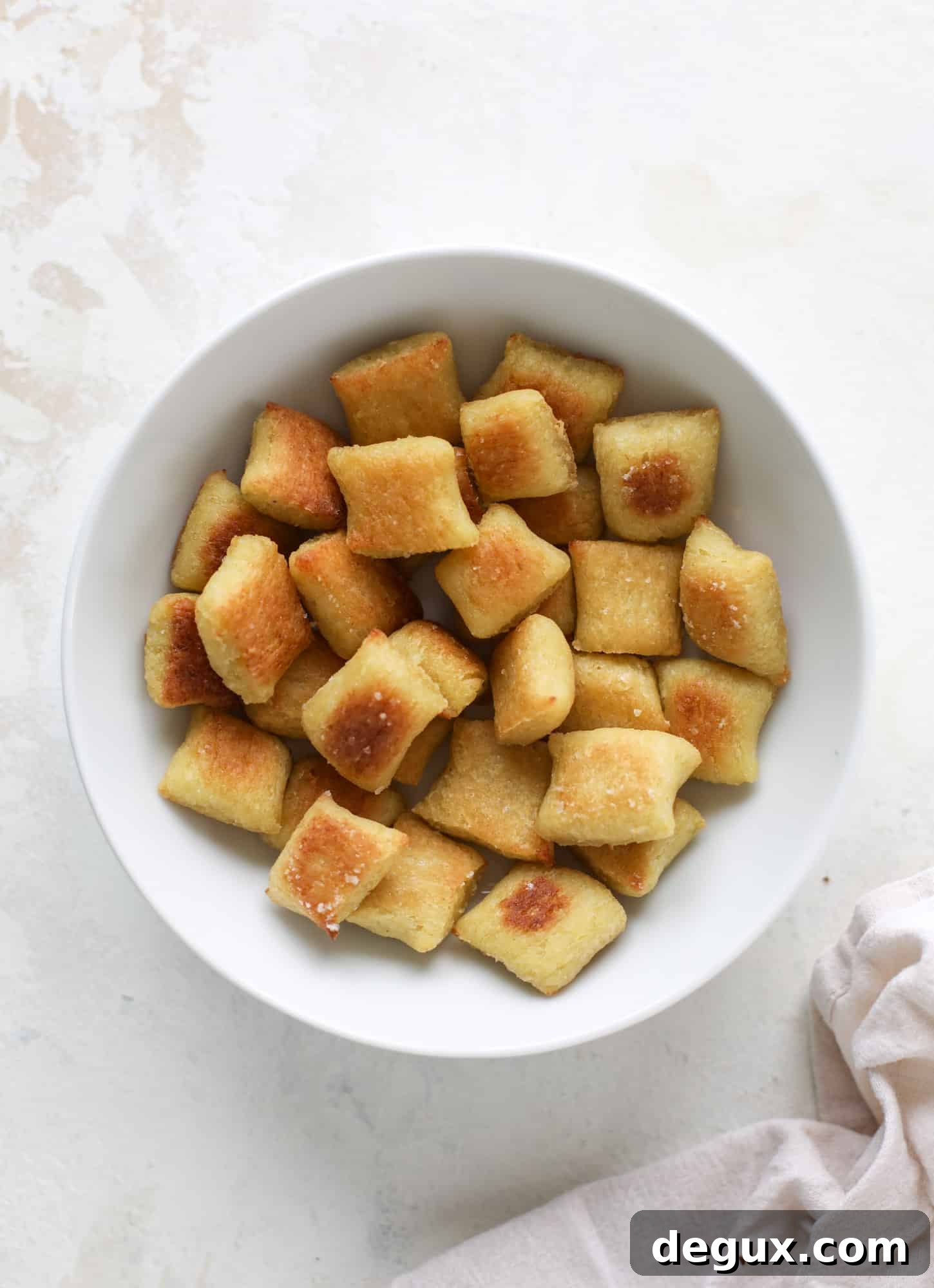 Cauliflower Gnocchi Recipe (Step-by-Step Video) 8 Homemade cauliflower gnocchi that tastes just like the Trader Joe's version! It's made with cauliflower, comes together fast and is super easy! I howsweeteats.com #cauliflower #gnocchi