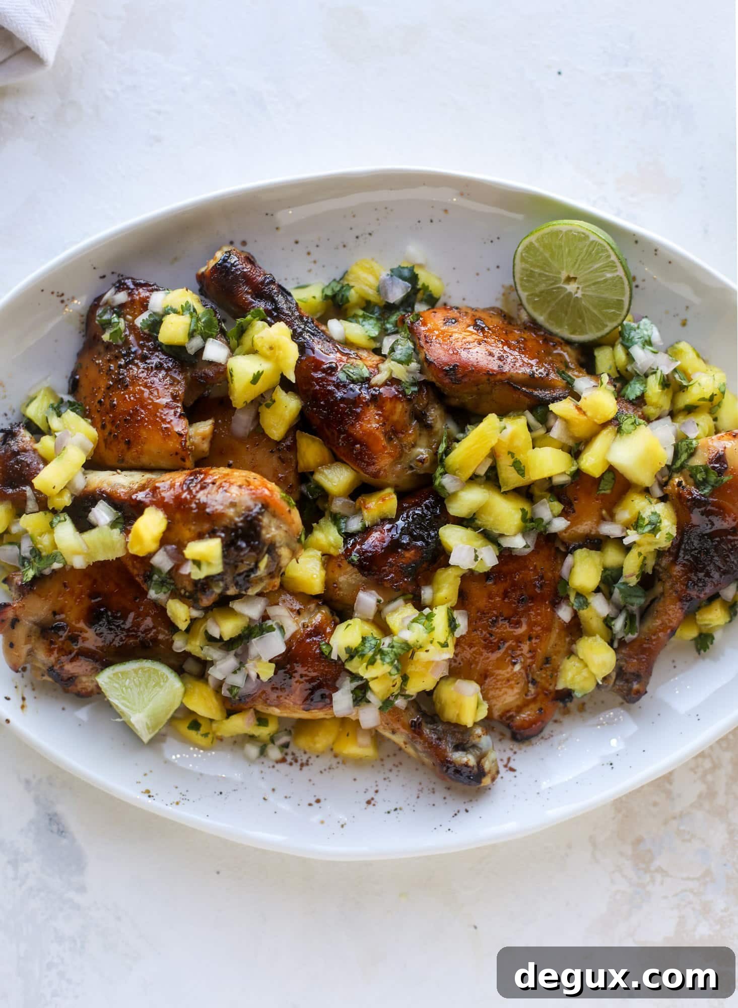 Sticky Sheet Pan Chicken with Fresh Pineapple Salsa Recipe 5 This sticky chicken recipe is made on a sheet pan and roasted until flavorful and sticky with sauce, then served with pineapple salsa. It's the best!