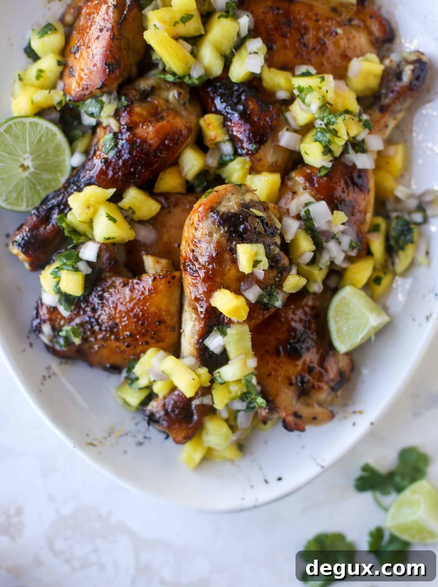 Sticky Sheet Pan Chicken with Fresh Pineapple Salsa Recipe 7 This sticky chicken recipe is made on a sheet pan and roasted until flavorful and sticky with sauce, then served with pineapple salsa. It's the best!