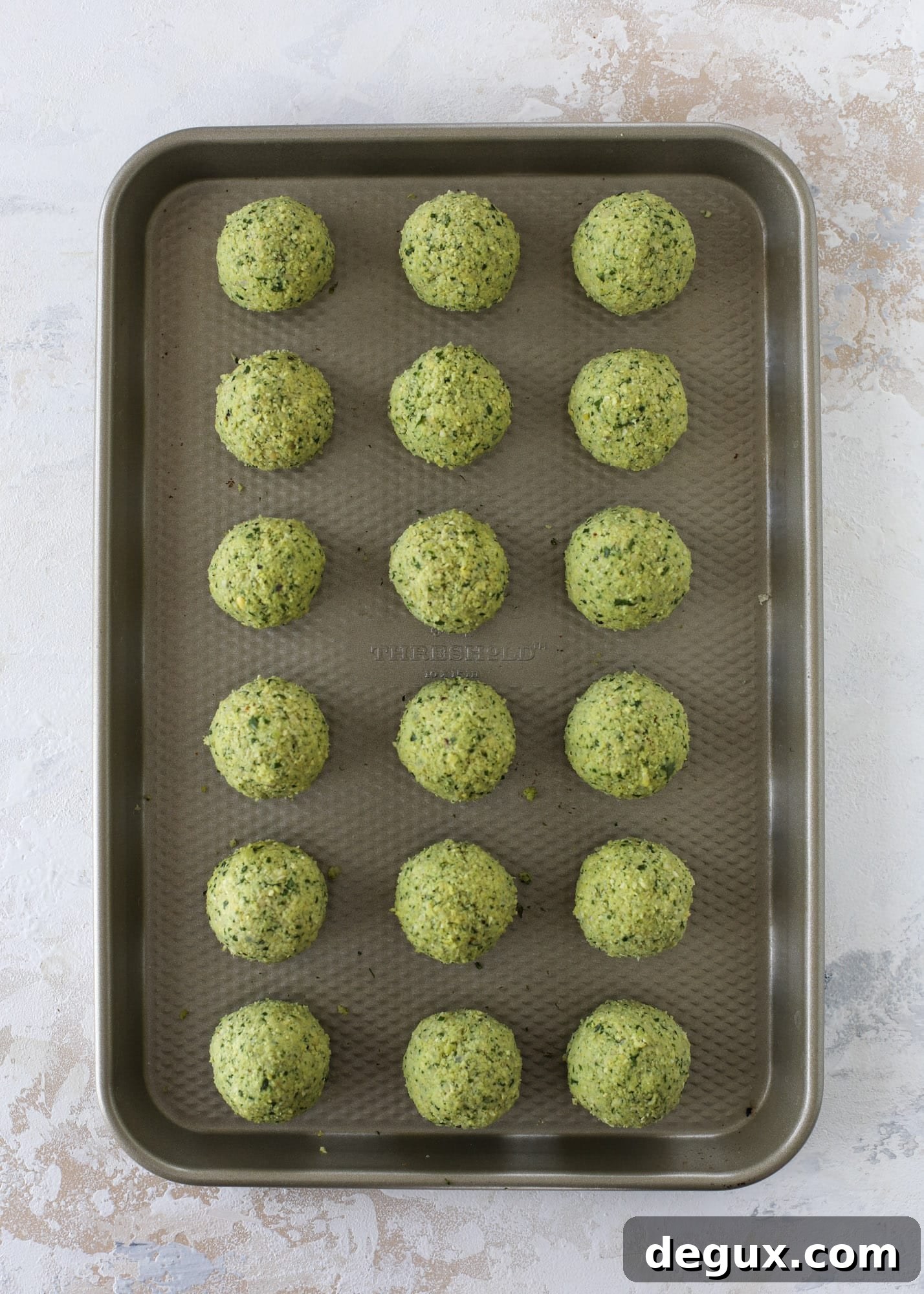Green Goddess Falafel with Creamy Cauliflower Hummus 3 Green goddess falafel is hearty and flavorful, served over the creamiest cauliflower hummus, with tomatoes, olive, cucumbers and feta. Yum! I howsweeteats.com #falafel #cauliflowerhummus