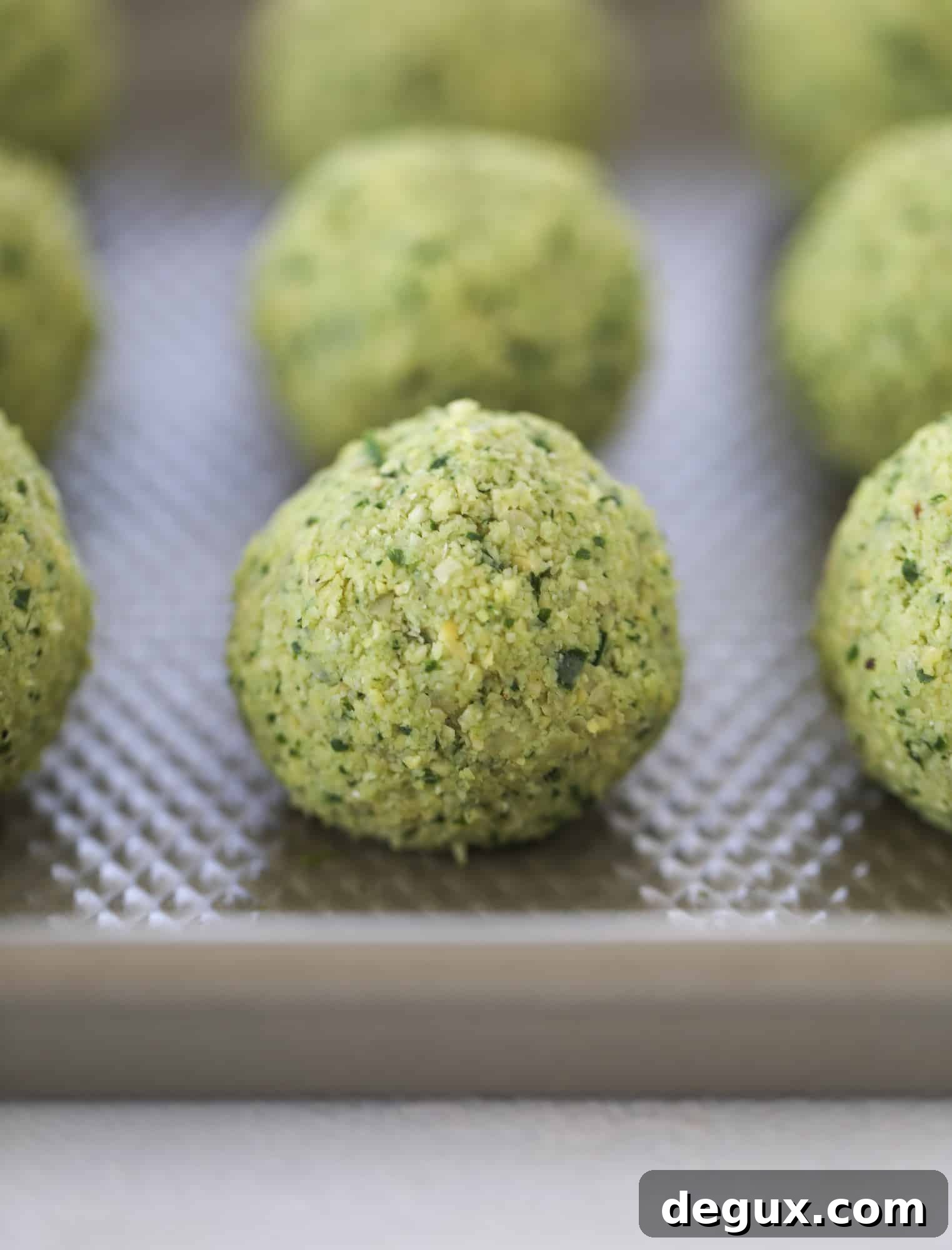 Green Goddess Falafel with Creamy Cauliflower Hummus 6 Green goddess falafel is hearty and flavorful, served over the creamiest cauliflower hummus, with tomatoes, olive, cucumbers and feta. Yum! I howsweeteats.com #falafel #cauliflowerhummus