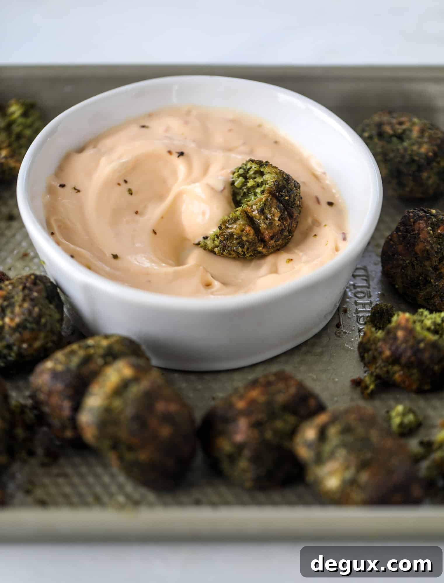 These broccoli cheddar tots are baked, crispy bites of broccoli and sharp cheddar cheese! So delicious and easy to throw together too. I howsweeteats.com #broccolicheddar #tots