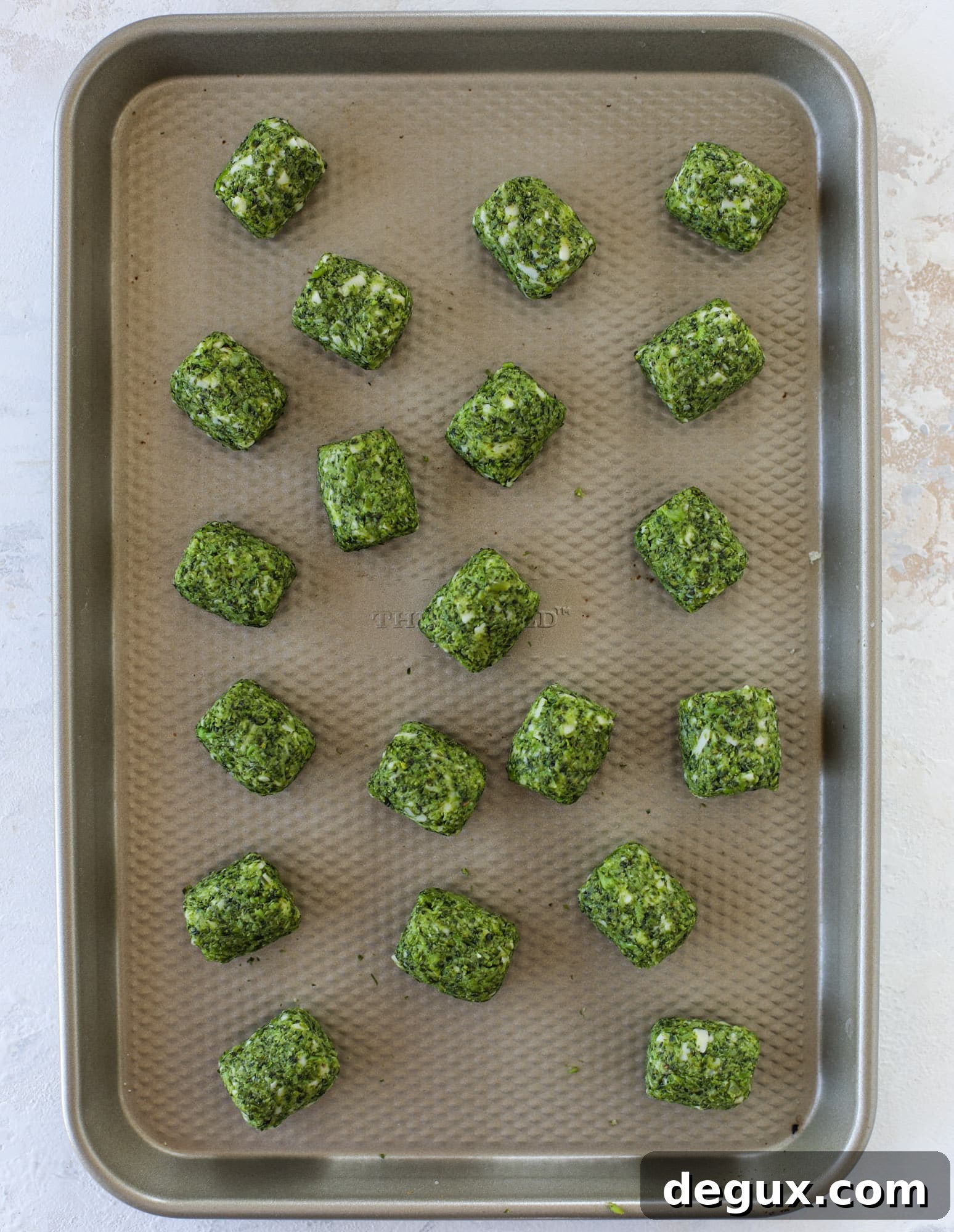 These broccoli cheddar tots are baked, crispy bites of broccoli and sharp cheddar cheese! So delicious and easy to throw together too. I howsweeteats.com #broccolicheddar #tots