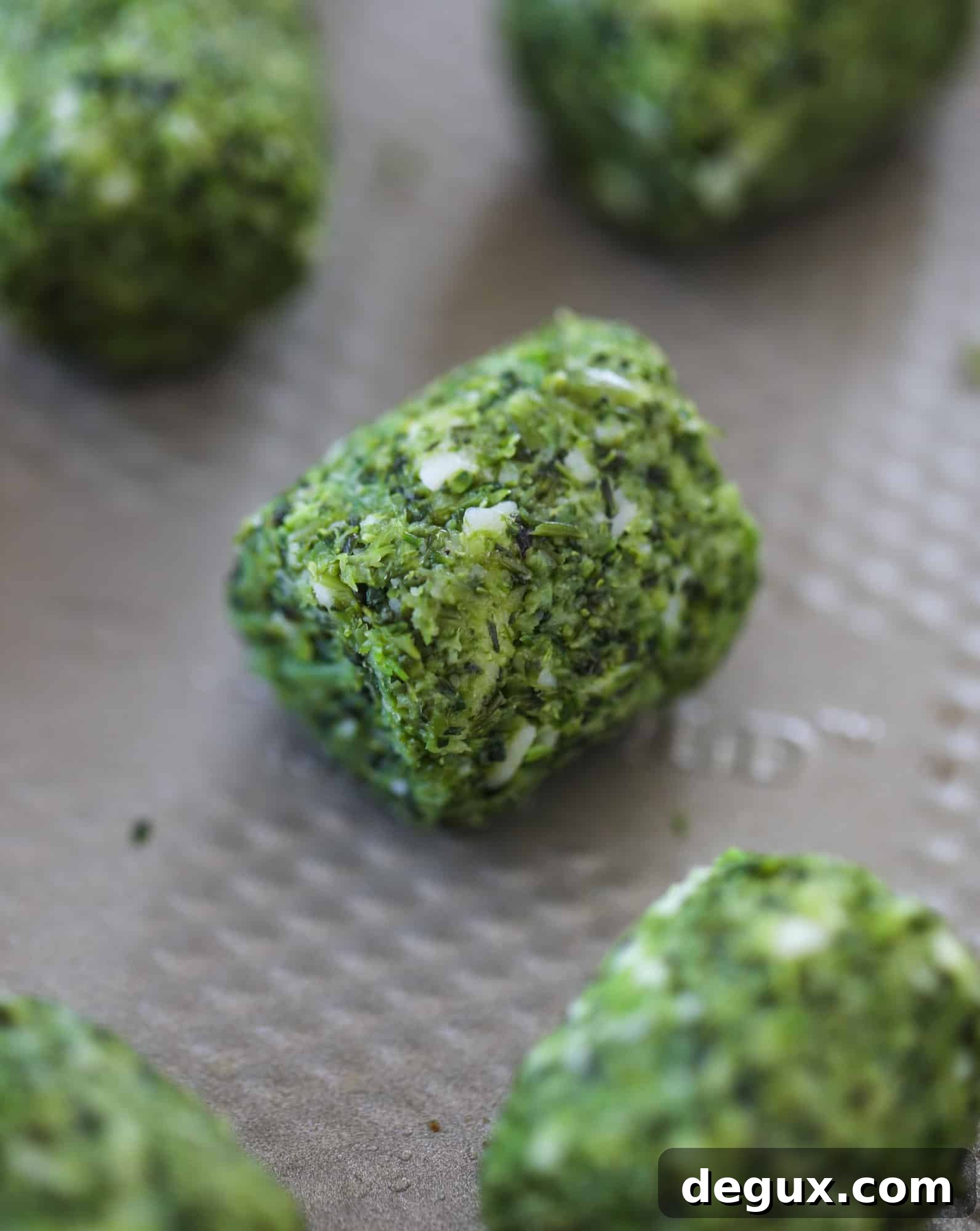 These broccoli cheddar tots are baked, crispy bites of broccoli and sharp cheddar cheese! So delicious and easy to throw together too. I howsweeteats.com #broccolicheddar #tots